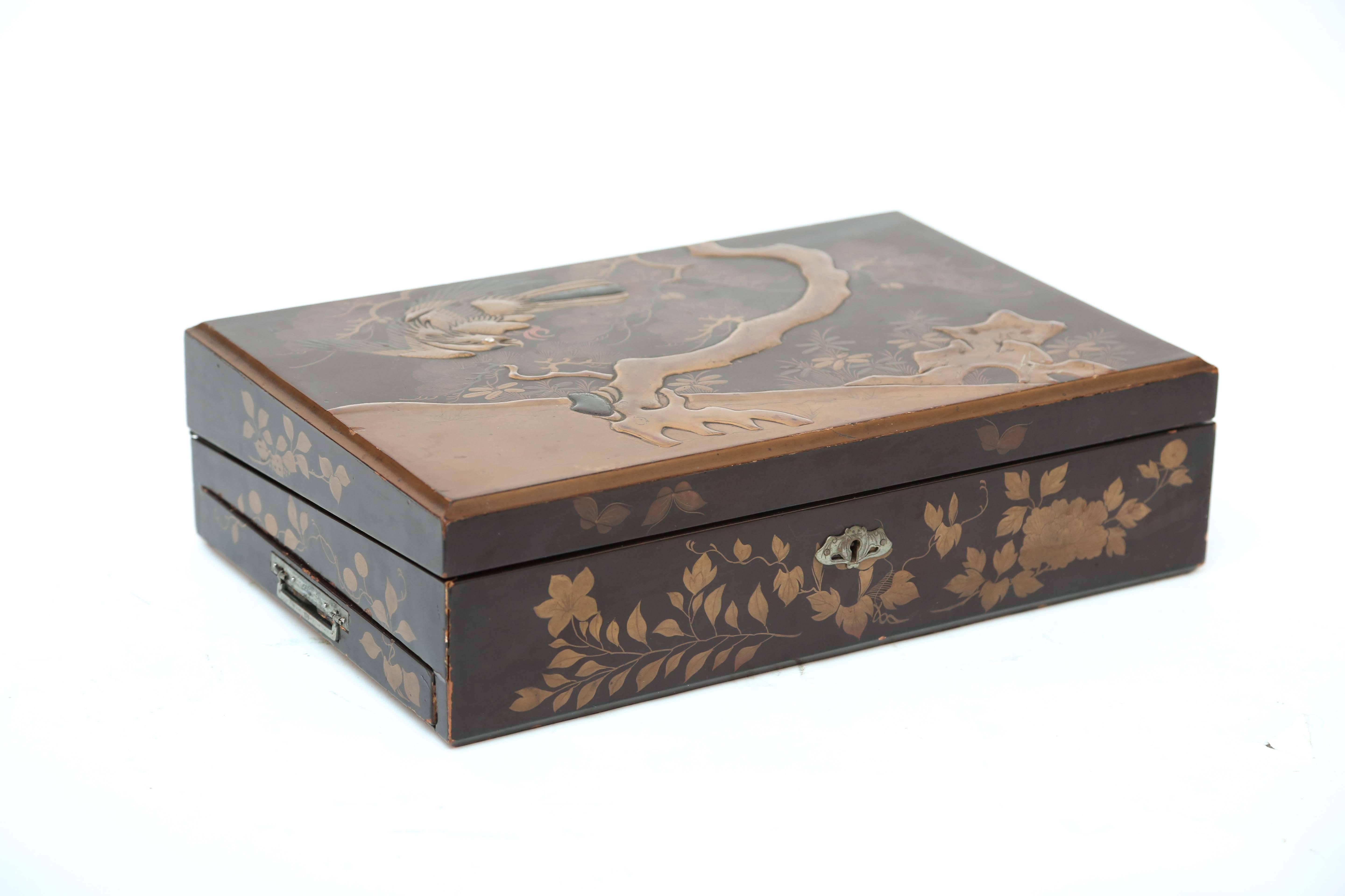 A fine Meiji lap desk. Superbly lacquered featuring a detailed figure of an eagle.