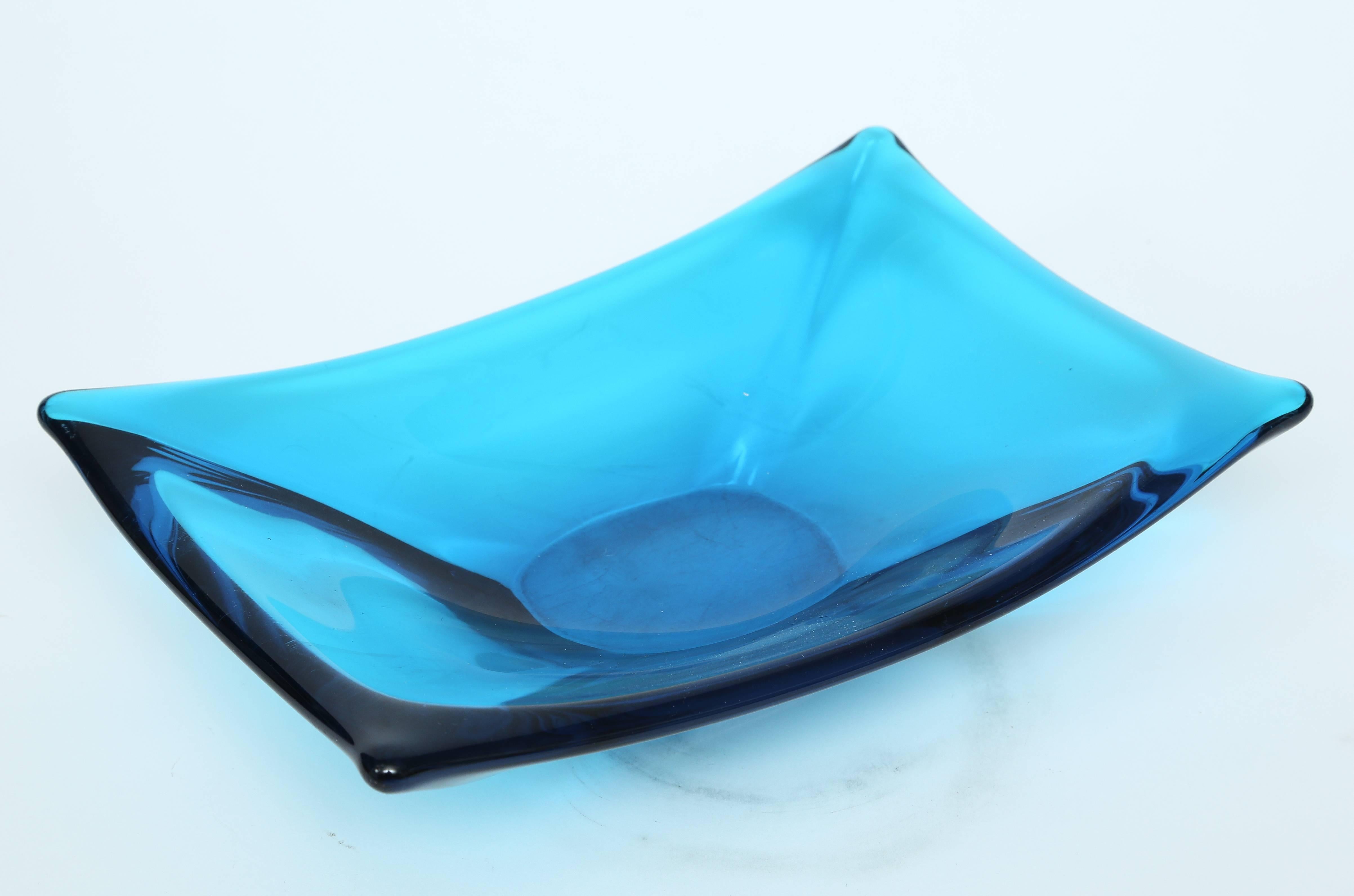 Handblown thick blue glass table accessories. All pieces sgnd. and in perfect vintage condition. This is sold as a set of three.

Center table / bowl: 12
