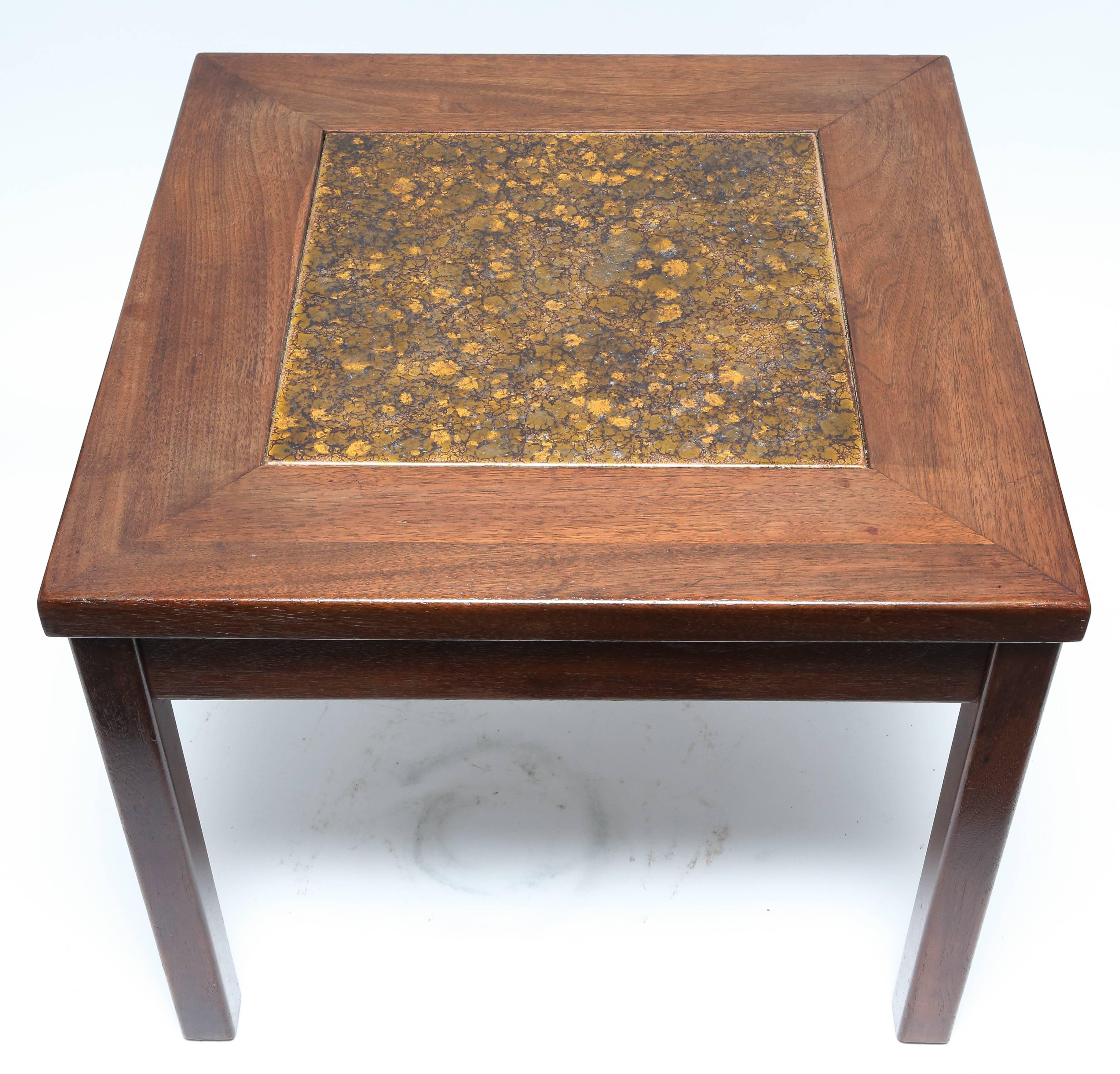 Constructed of walnut with rich stain fin. Copper enamel tile inset in constellation pattern centers; these tables are in very good vintage condition. Each table is signed.