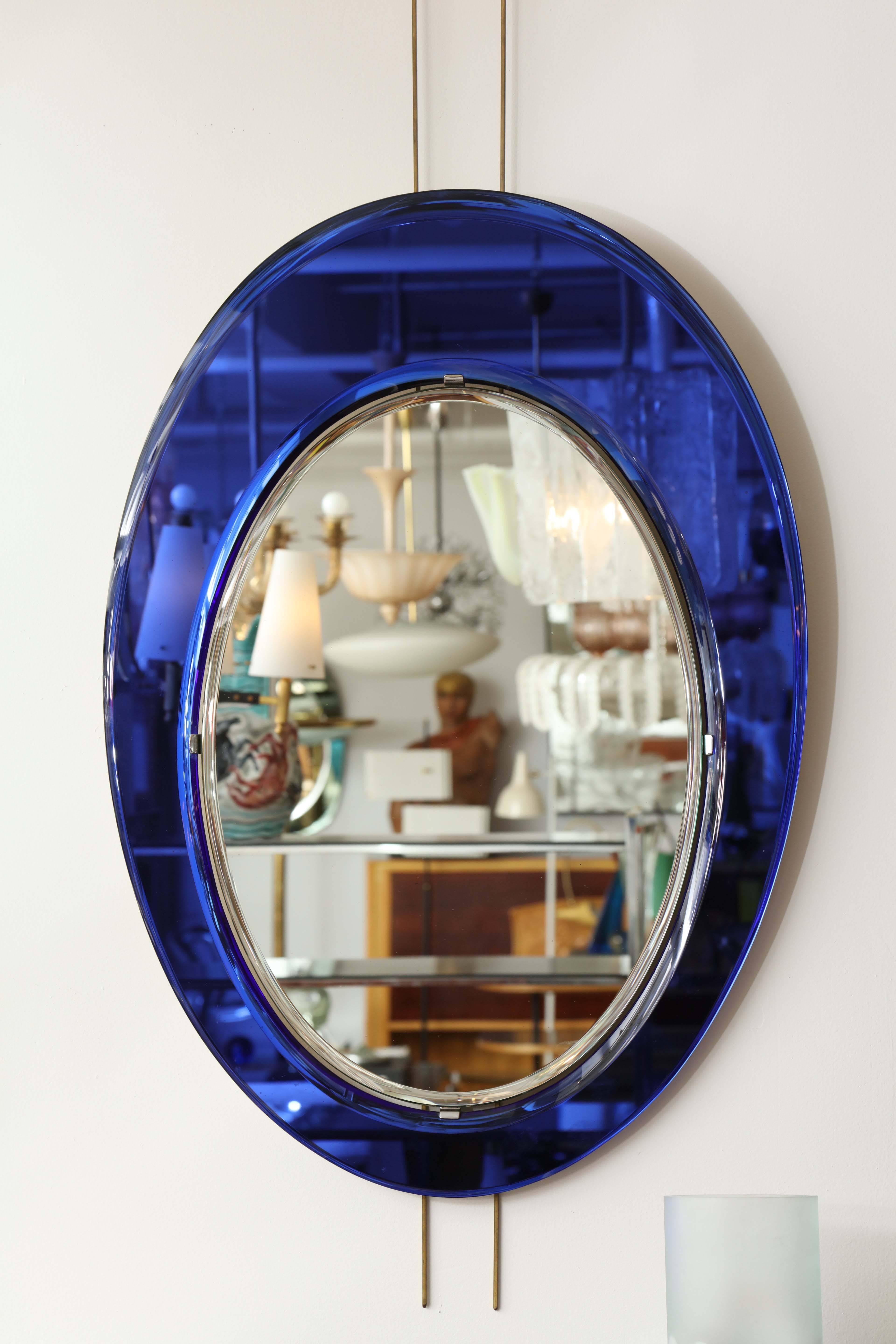 Stunning oval violet mirror made in Italy 1955 by Cristal Arte, unusual color and form, great quality, a real beauty.
 