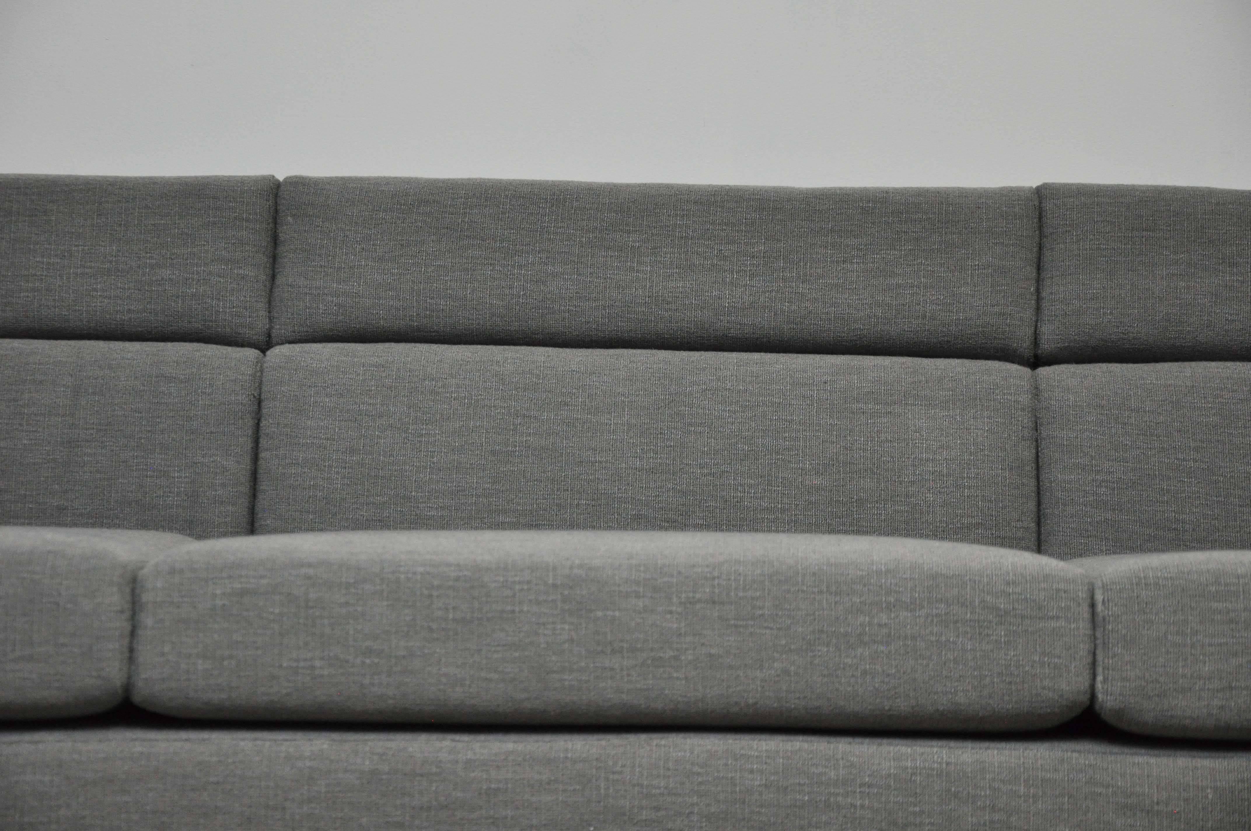 Channel sofa model 7140 designed by Roger Sprunger for Dunbar. Fully restored with new textured grey fabric.