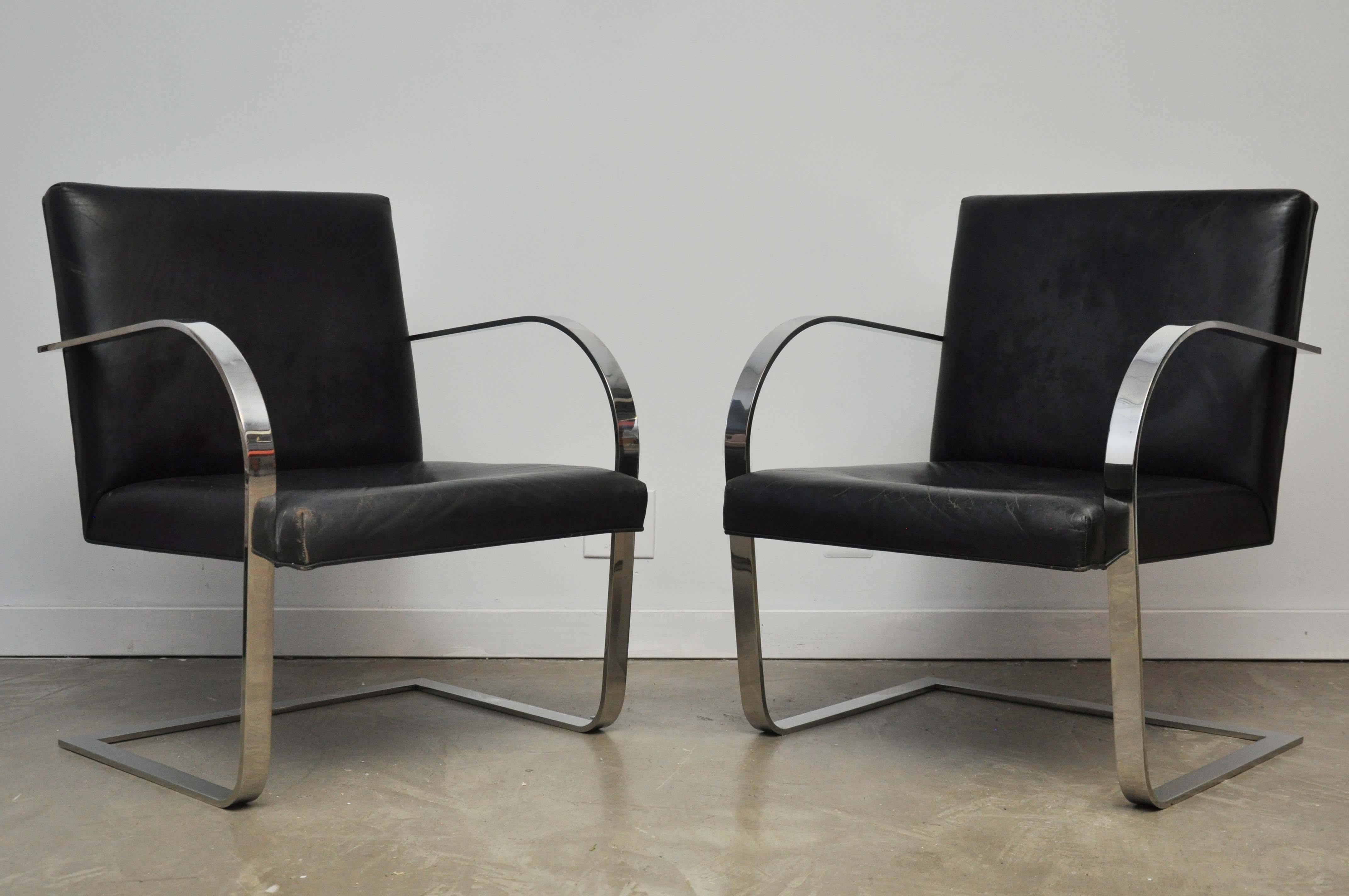 Rare Brno lounge chairs by produced by Brueton. Original black leather with nice patina. Polished flat bar frames.
