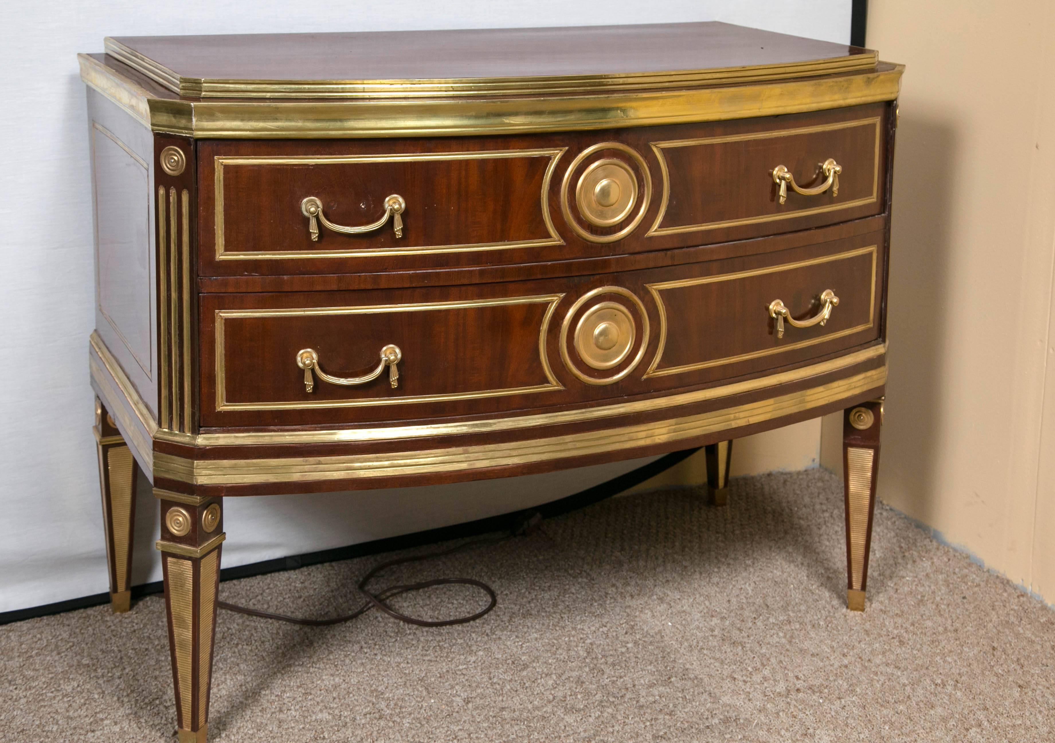 Pair of Russian neoclassical demilune commodes or bedside stands. One of a kind pair of fine quality commode or nightstands. Each having all-over bronze mounts with bronze framed drawers using drapery form pulls flanking a circular bronze decorative