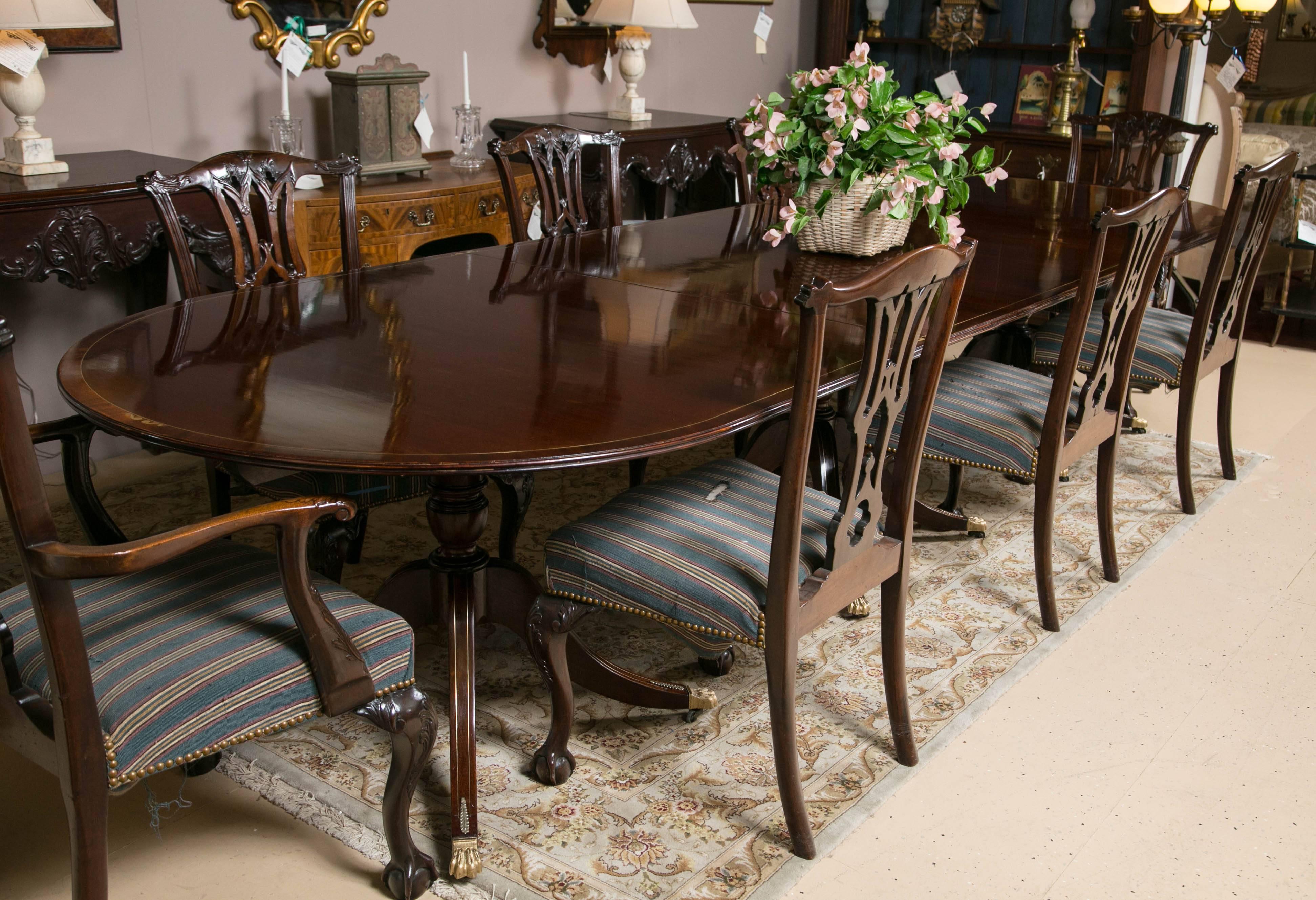 Finest Georgian boule inlaid solid rosewood triple pedestal banquet table. An impossible find located on long islands gold coast comes this solid rosewood dining room table with a wonderful boule (brass) detailed inlay. The quad form boule inlaid