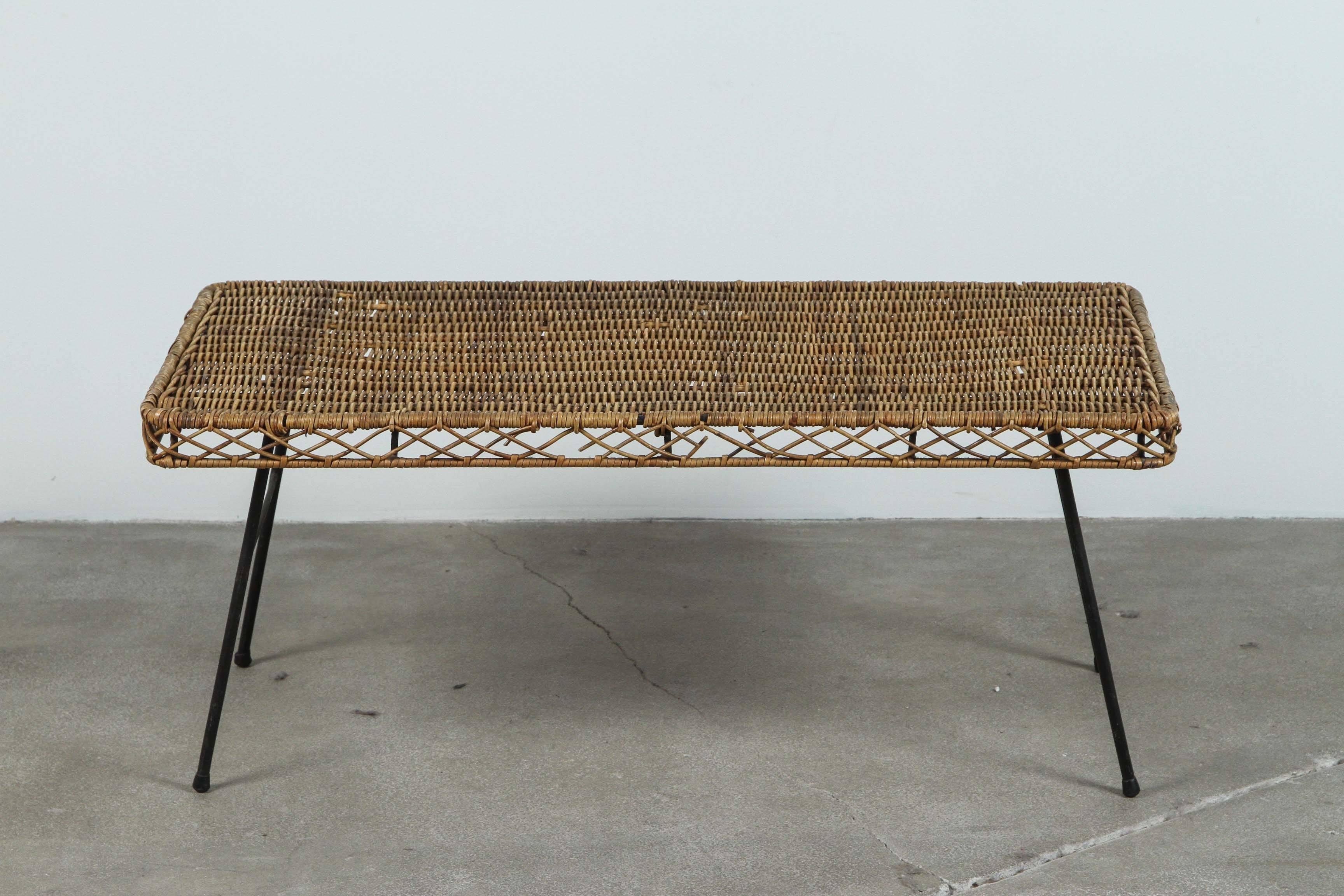 Low rattan and iron rectangular table in the style of Arthur Umanoff.