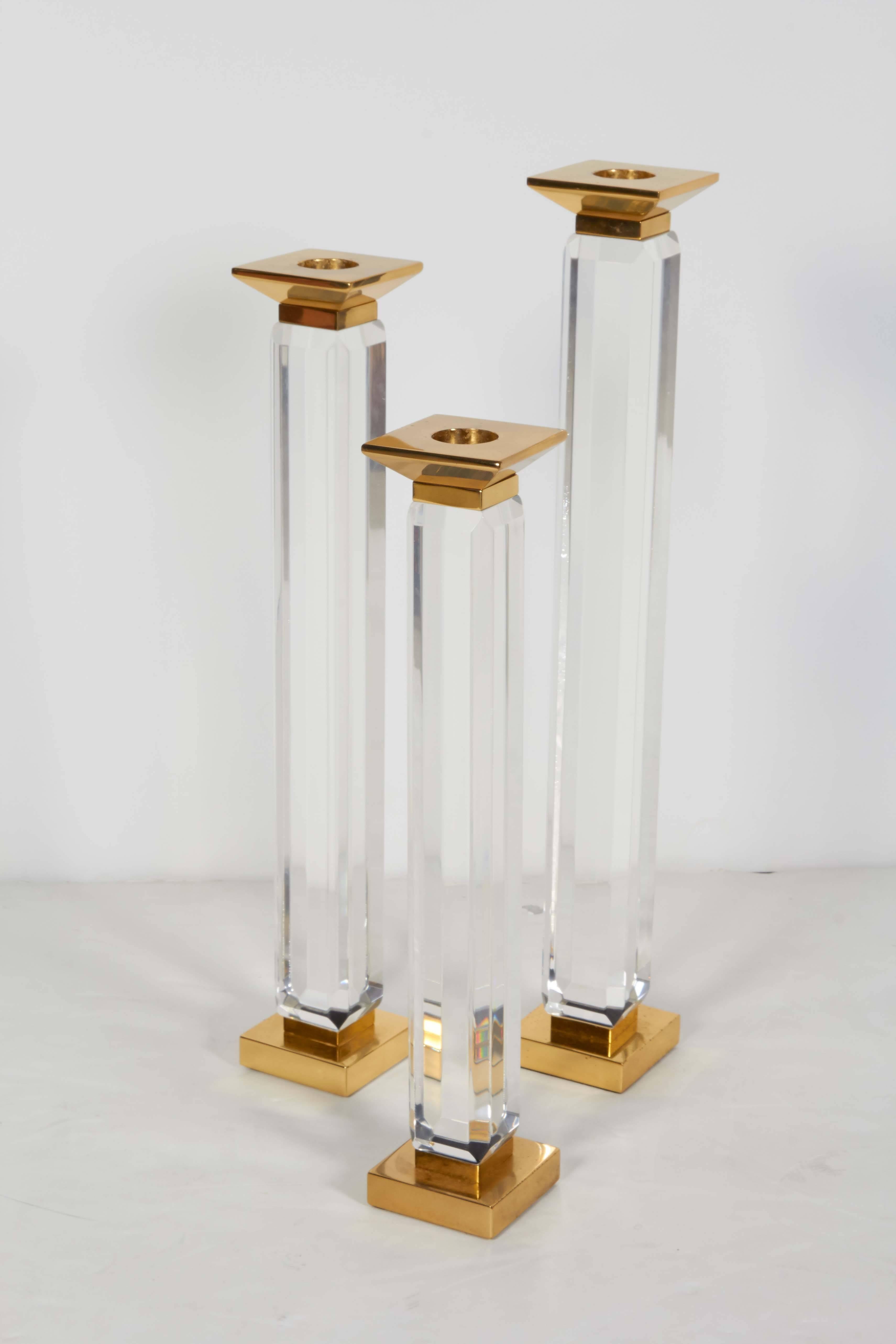 Charles Hollis Jones candleholders. Measures: The trio of candleholders start at 20" high. The medium one is 18". The last one is 16".