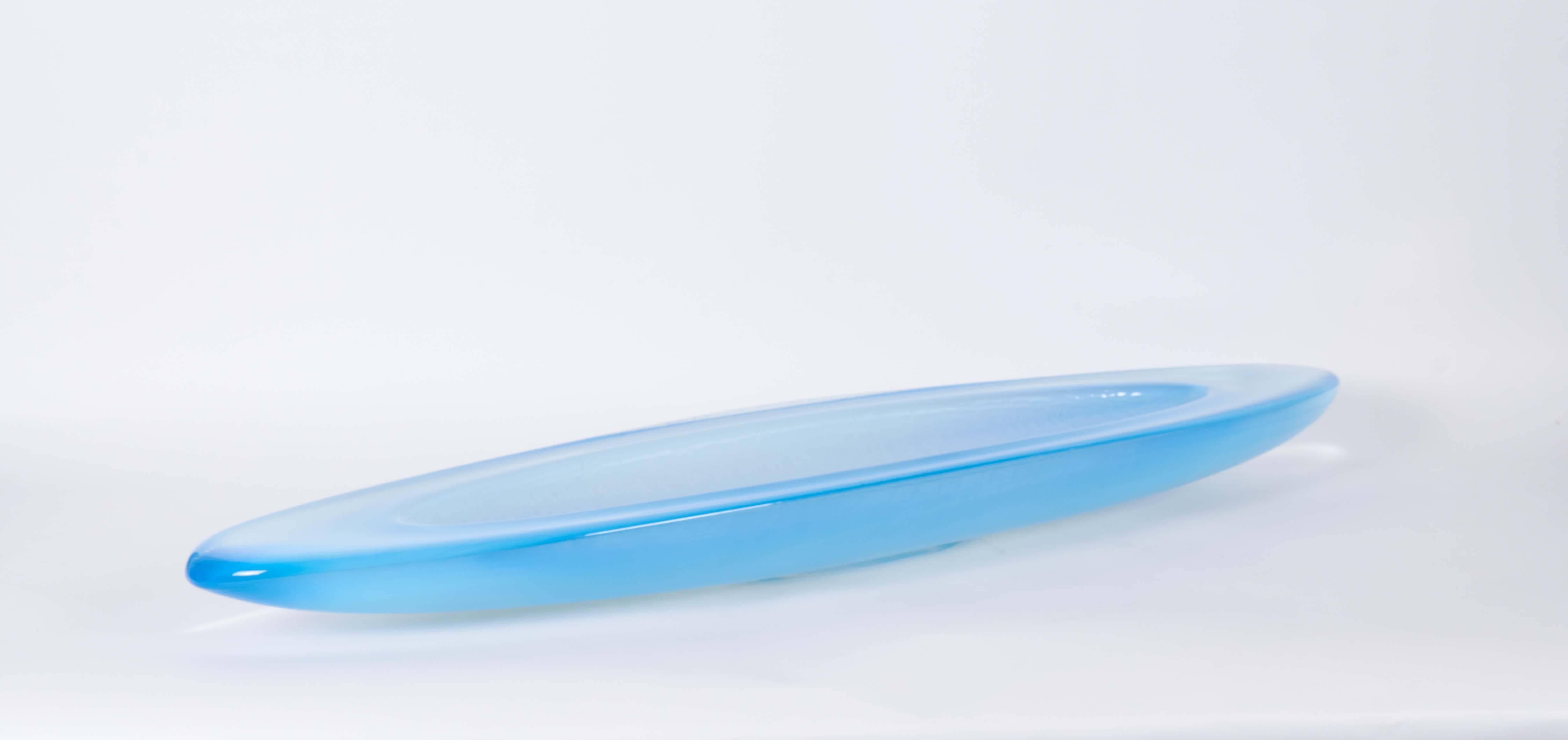 A lengthy oval form decorative bowl by contemporary glass artist George Bucquet, in cast, blue opaline glass. Very good condition, consistent with age and use.

10438