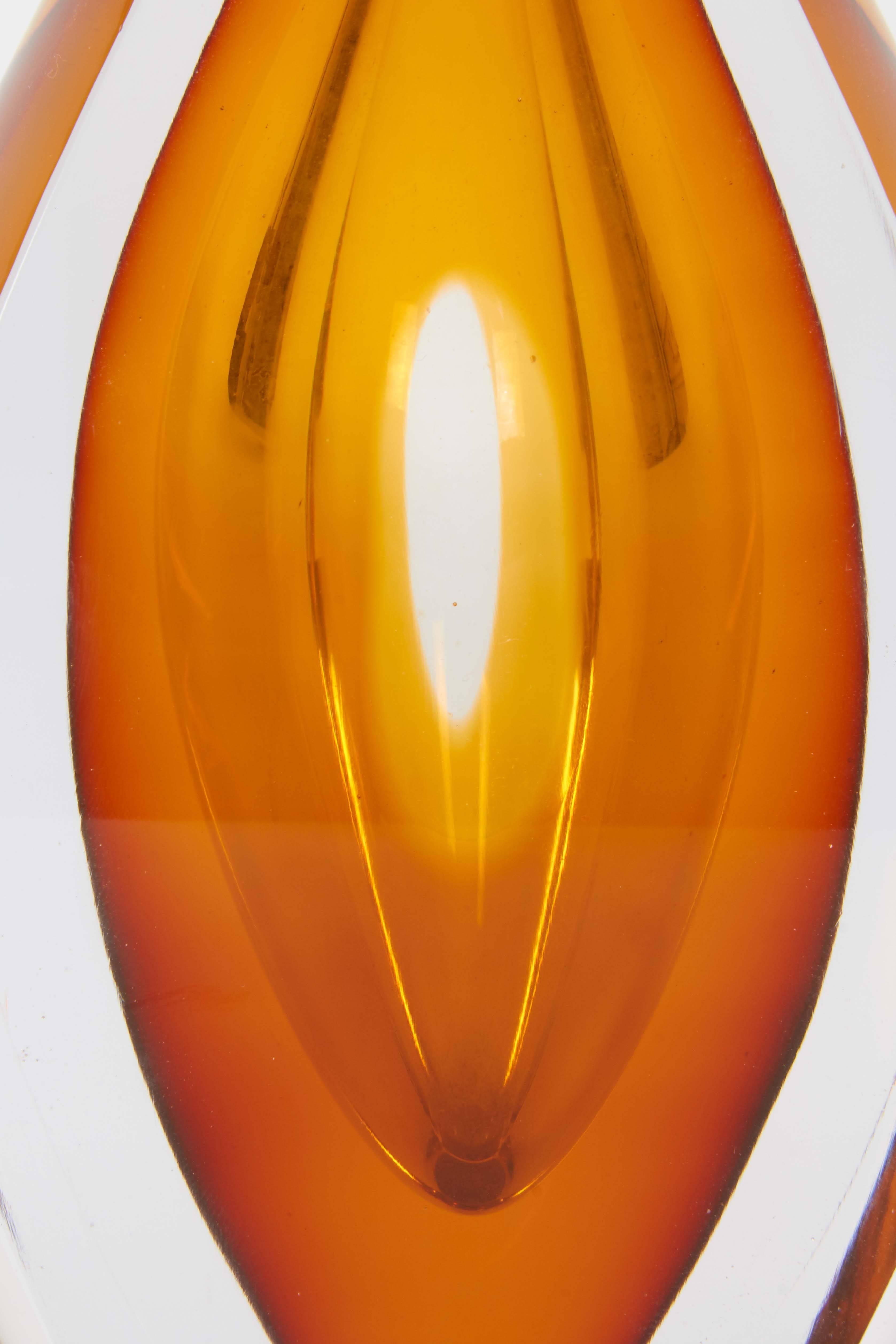 A drop-form Sommerso art glass vase by designer Mona Morales-Schildt from the Ventana series for Kosta Boda of Sweden, produced circa 1960s, with brilliant orange interior, clear faceted layer surrounding. Markings include [Kosta/S5169] to base.