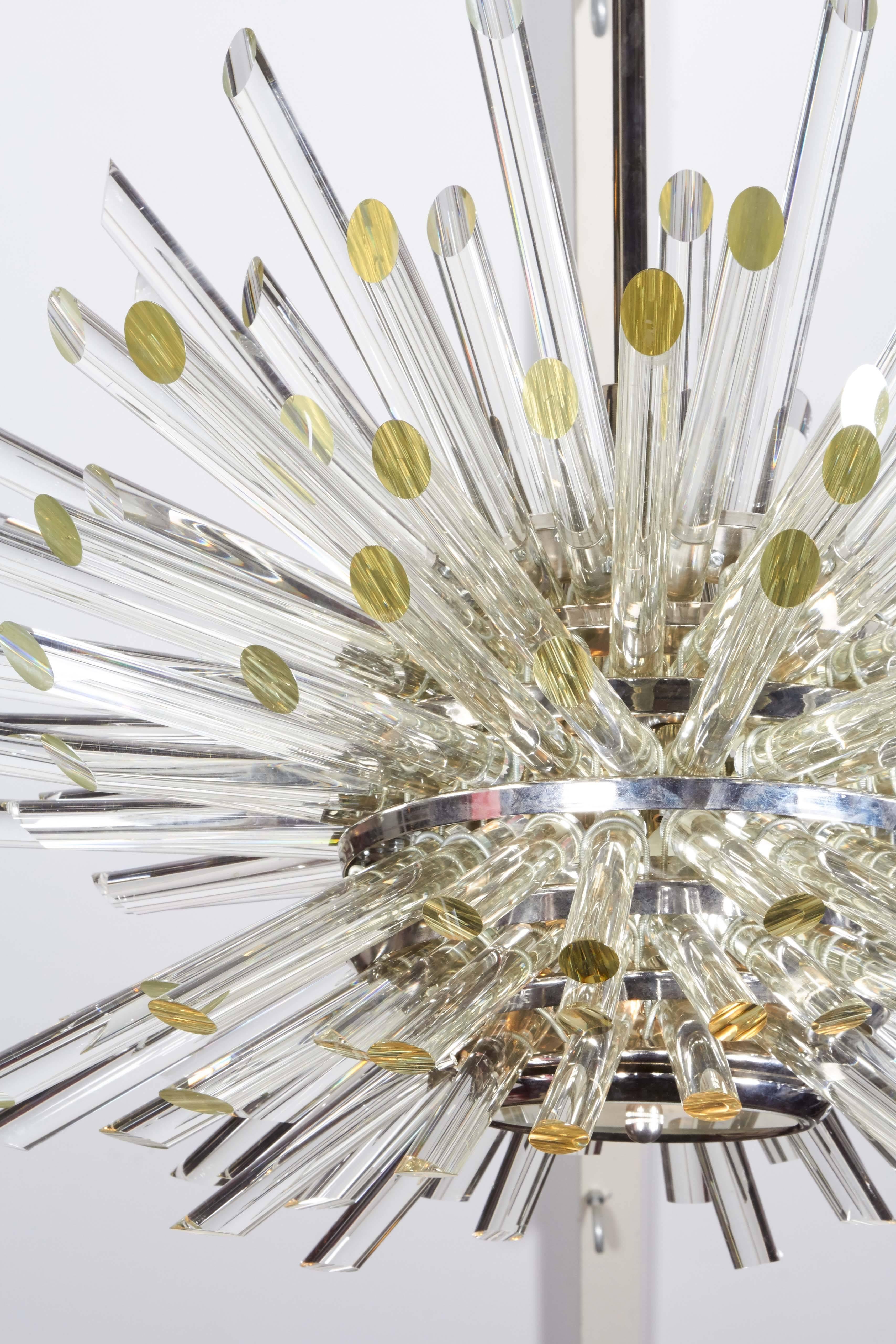 A highly modernist Sputnik chandelier, designed in the style of Bakalowits & Sohne, with round crystal prisms, affixed to a multi-tiered chrome frame. Very good condition and wear consistent with prior use. Dimensions provided reflect body.