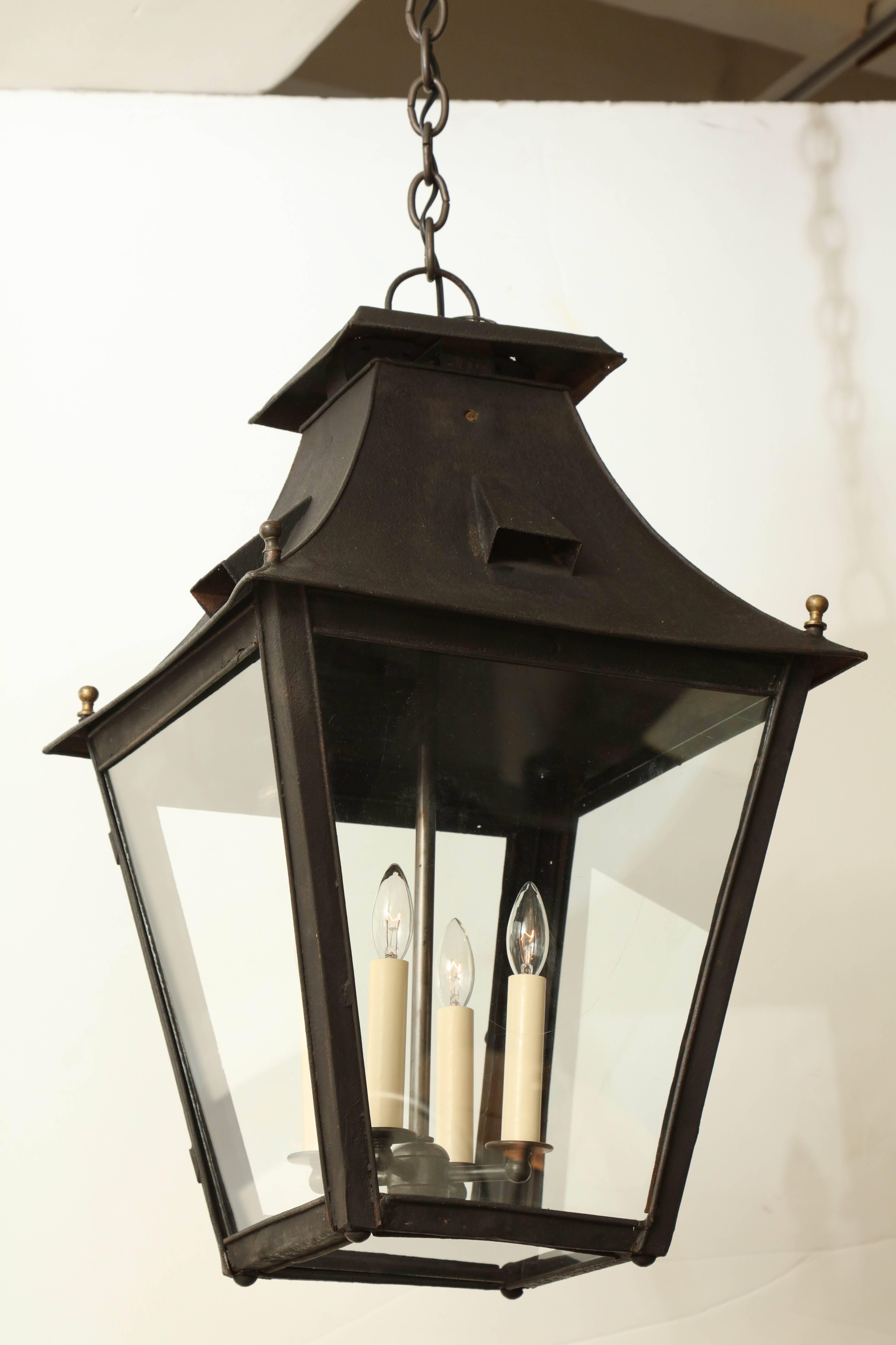 A large, 19th century painted metal lantern made in Italy. Square shape lantern with four candelabra lights. Recently rewired for US specifications, it is not UL listed.
Overall dimensions:
15.75” W 15.75” D 25” H.