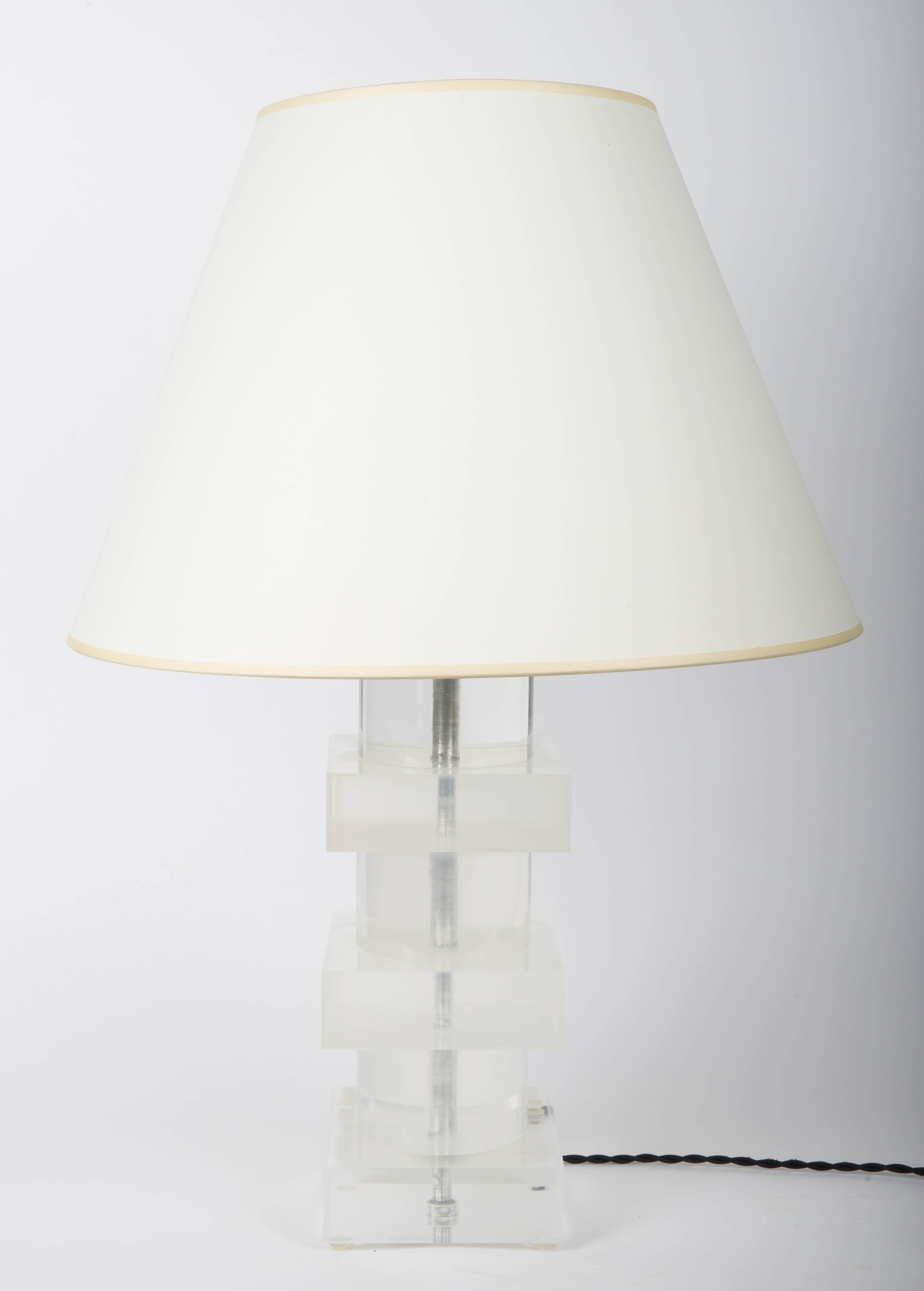 Lucite lamp with circular and square stacked layers.