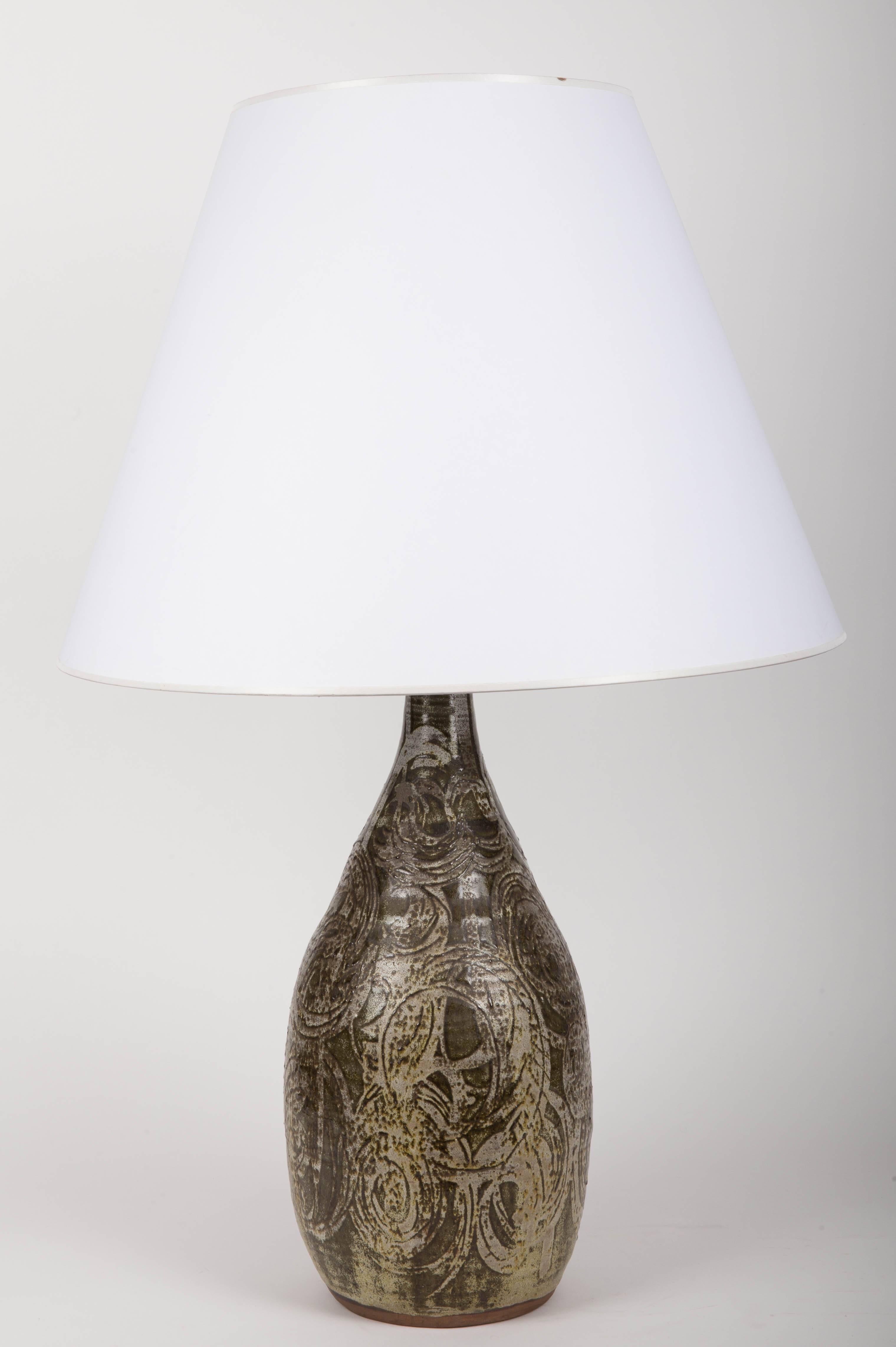 Gray and green table lamp.