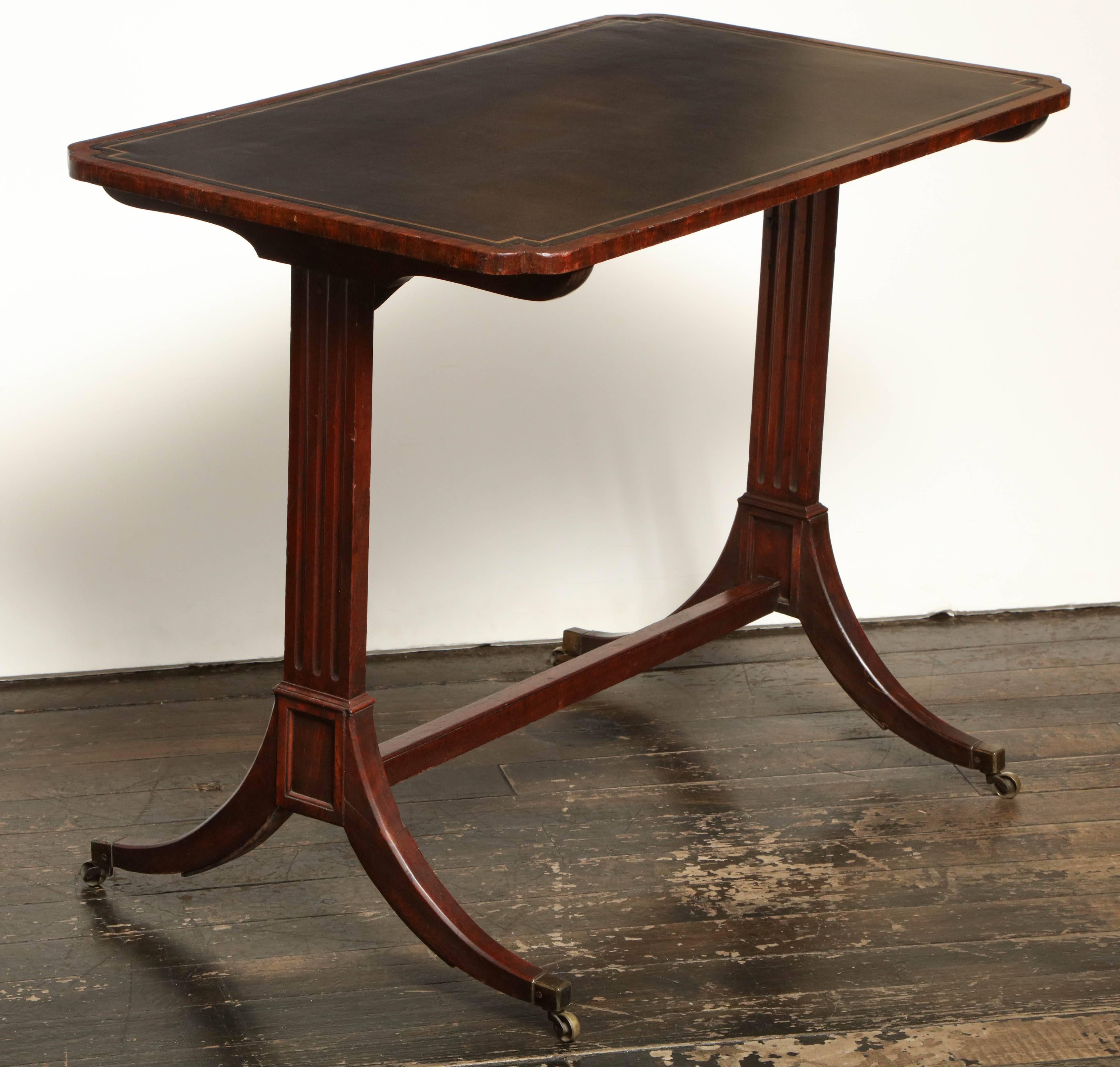 Early 19th century English Regency table or desk with leather top.
