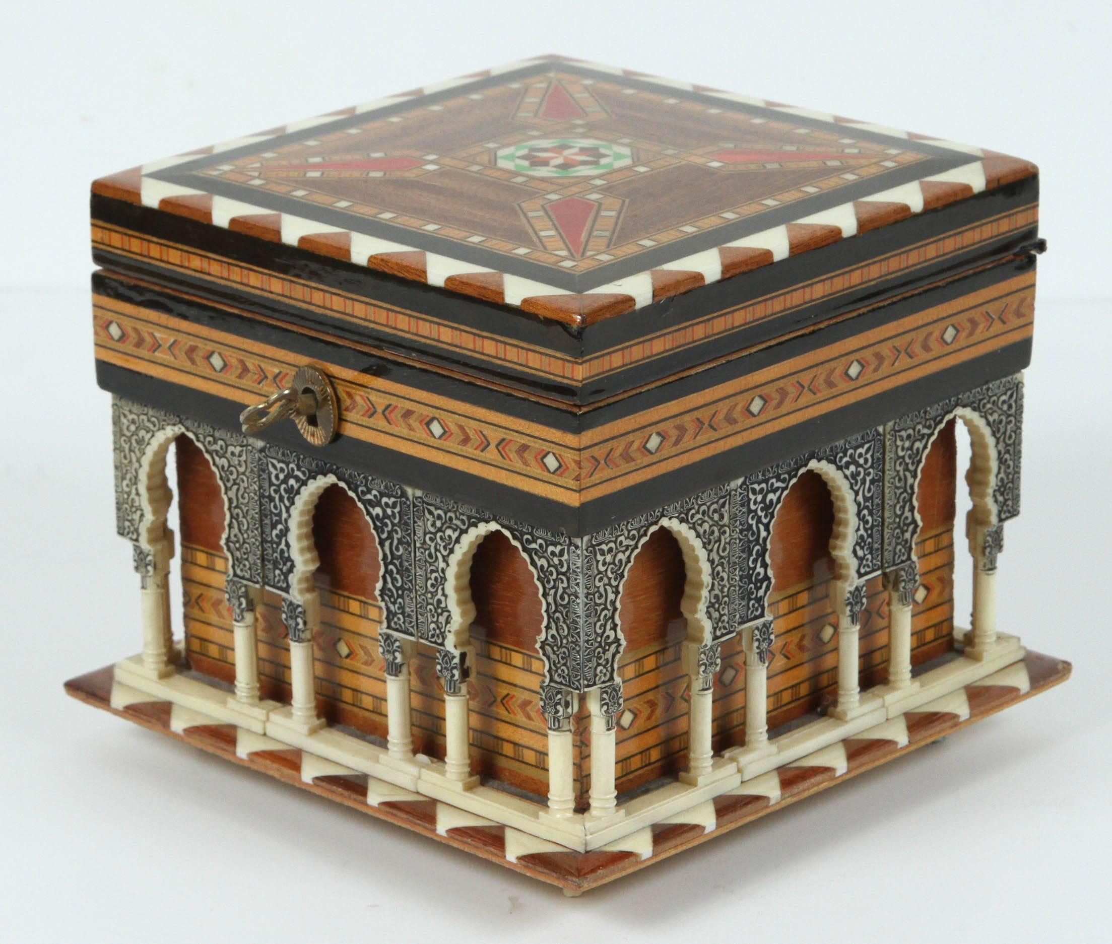 Handmade music box by Victor Molero, handcrafted in Granada, the box represent the Alhambra with Moorish arches, the outside is inlay with bone and marquetry, the inside is lined with red velvet.
The music movement is Swiss and the music is a