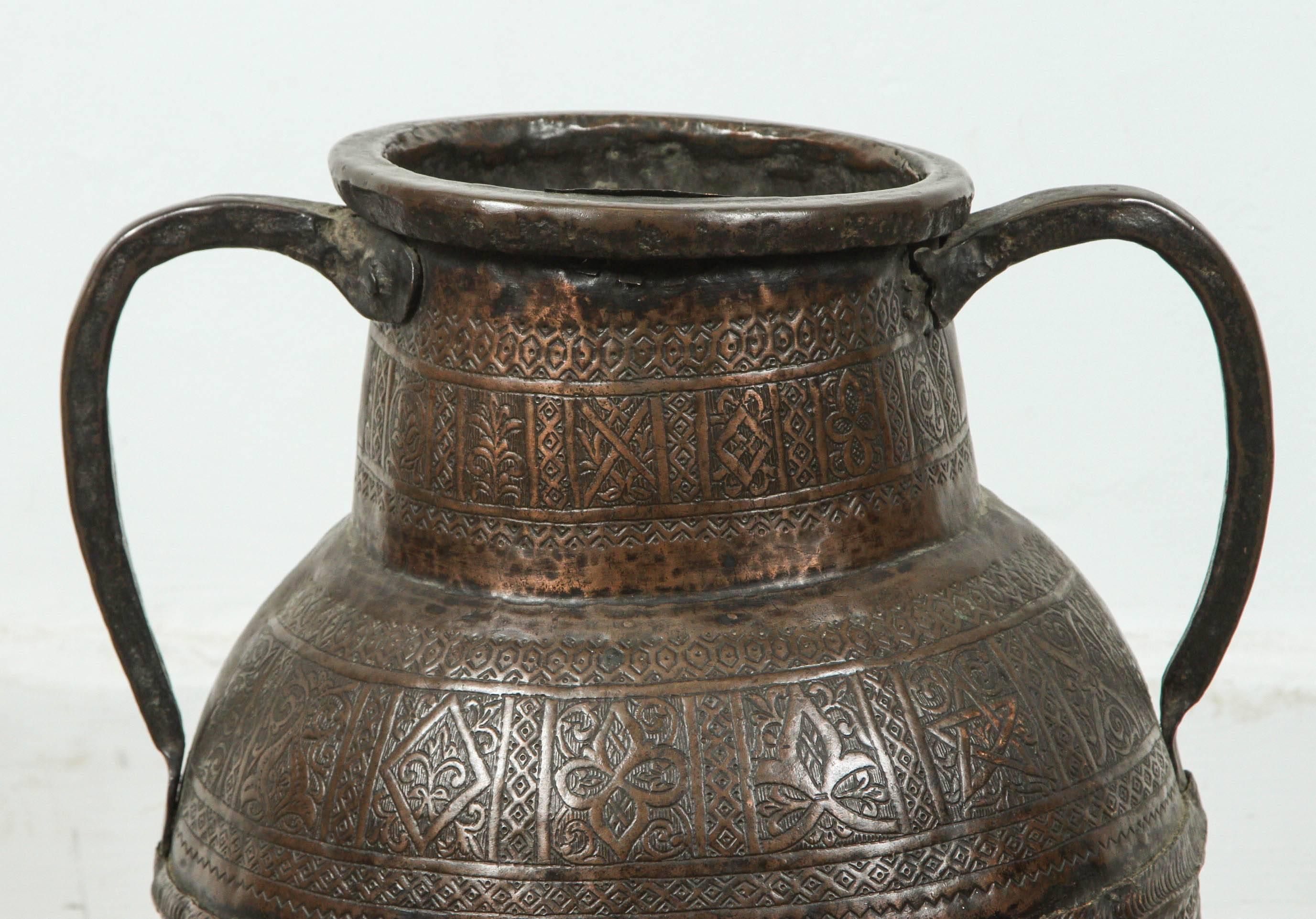 Antique Persian copper pot with handle, heavenly hand-hammered with intricate designs, Arabesque, stars and foliages.
Very old the top opening has been repaired, and there is some small holes, will not hold water.
Late 18th century, early 19th