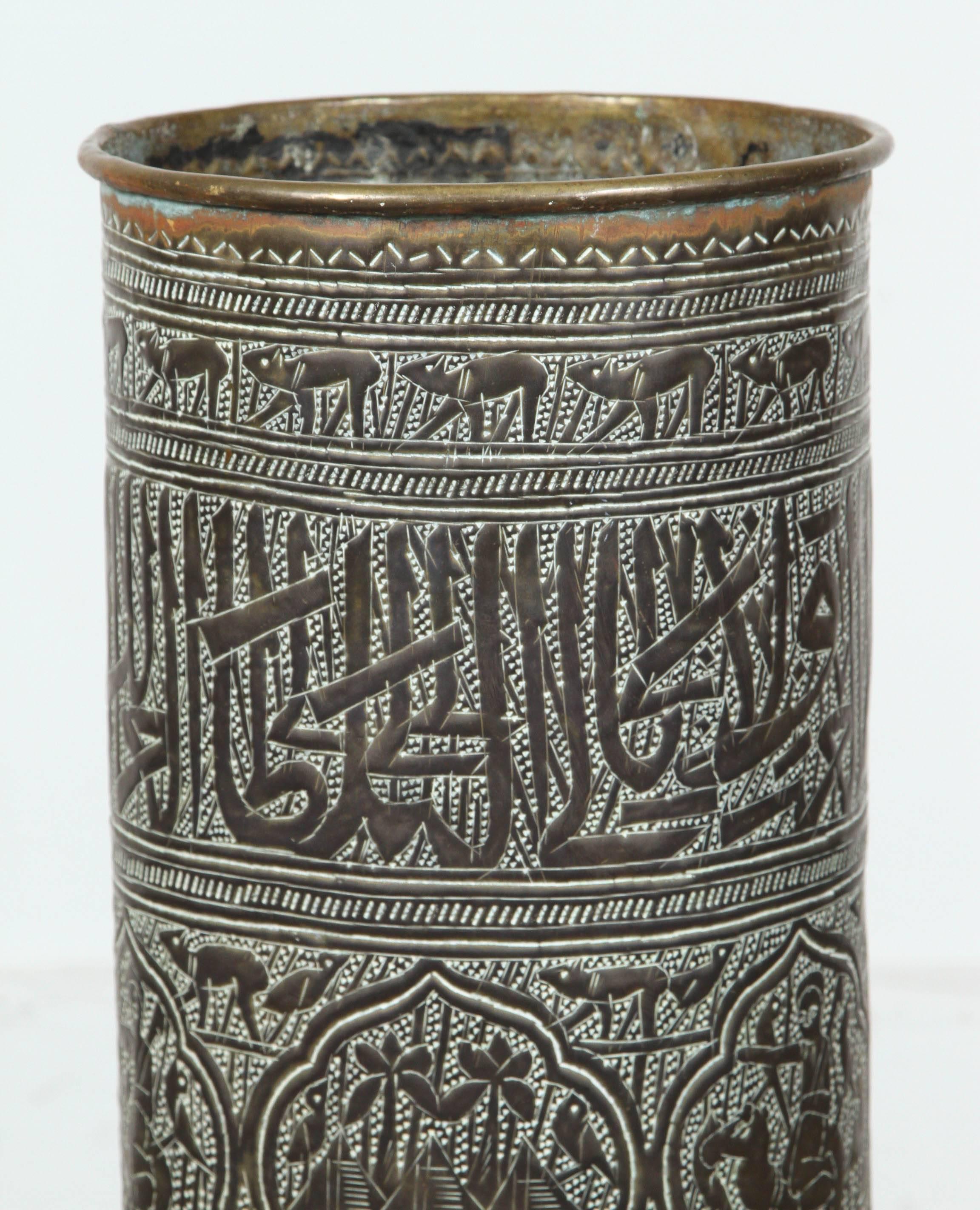 Rare and unique late 19th century Indo-Persian umbrella, cane stand with nice patina, featuring hand-hammered Arabic calligraphy writing and animals designs and desert scenes.
Nice antique patina.
Base is 11