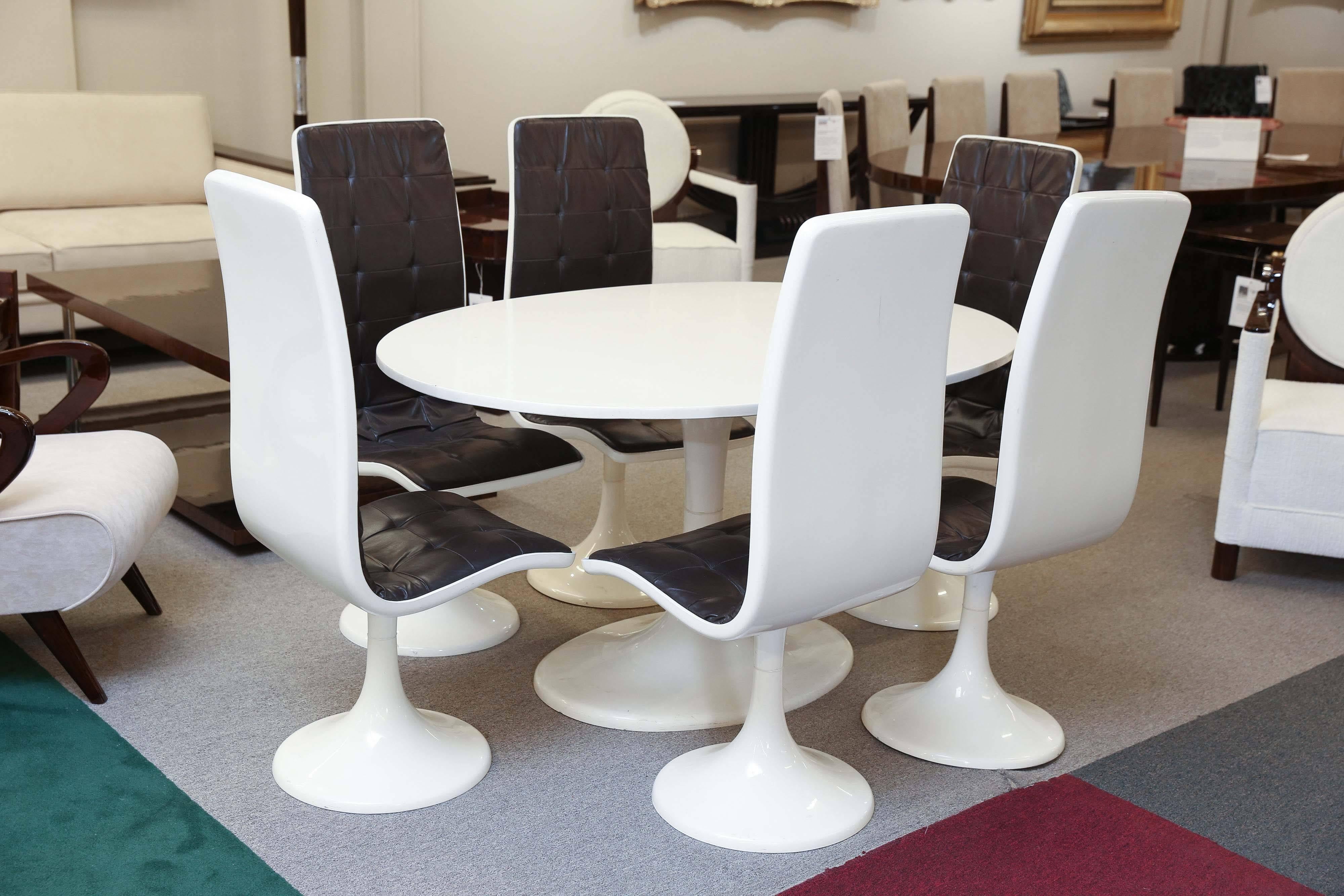 Dining set contains one table and six chairs. All chairs are upholstered in sectioned 