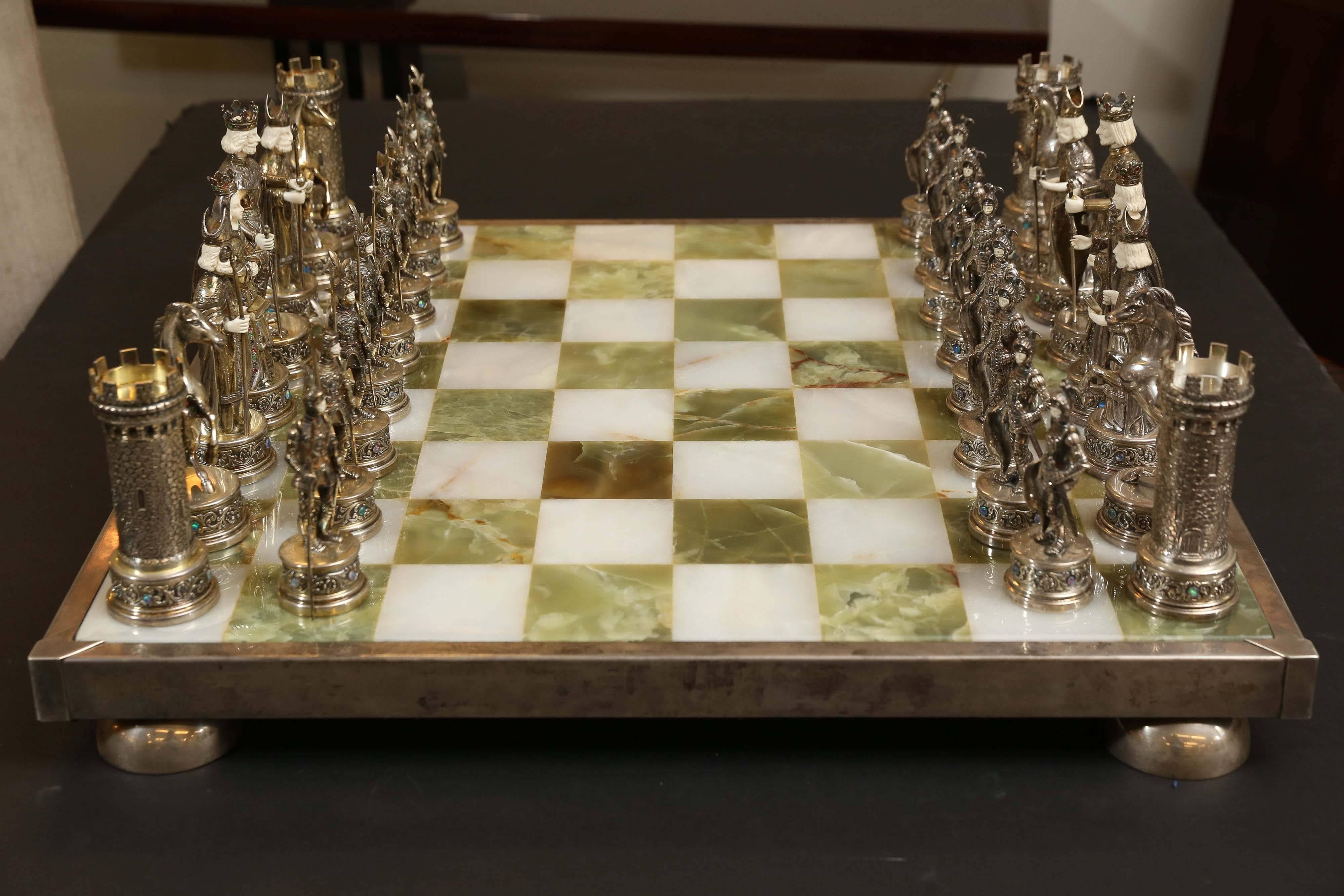 The magnificent 32 pieces chess set is made, circa 1900-1910 in Germany for export to England. The figures made out of sterling silver and gold washed sterling silver, stamped 