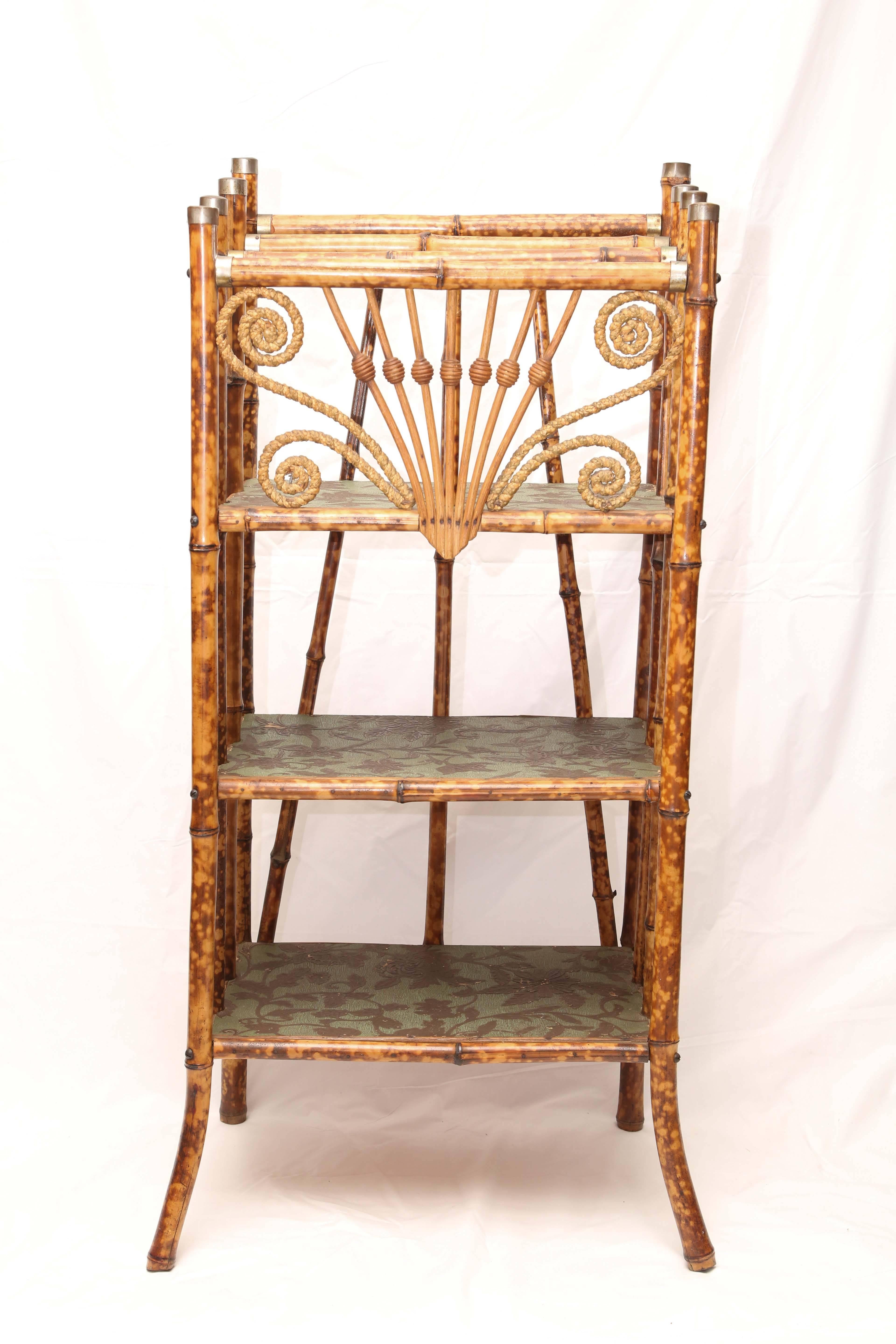 Very unusual 19th century English bamboo Canterbury three tops magazine rack with leather paper and great details.