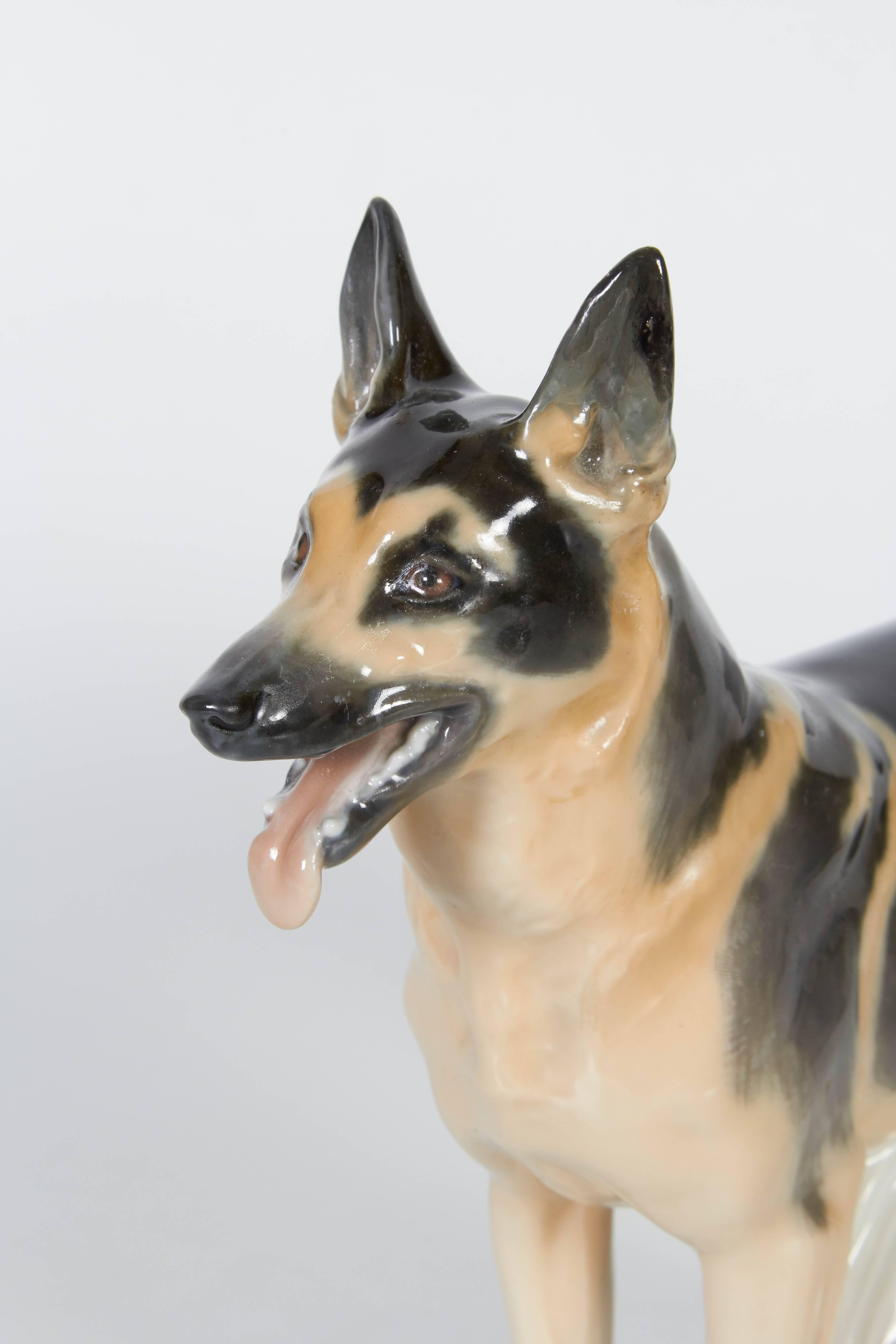An exquisitely crafted Meissen Porcelain figure of a German Shepherd dog from the sought after Pfeiffer Period. hand-painted underglaze in black and brown, bearing the famous blue cross underglaze mark, this piece is a collector’s item, circa