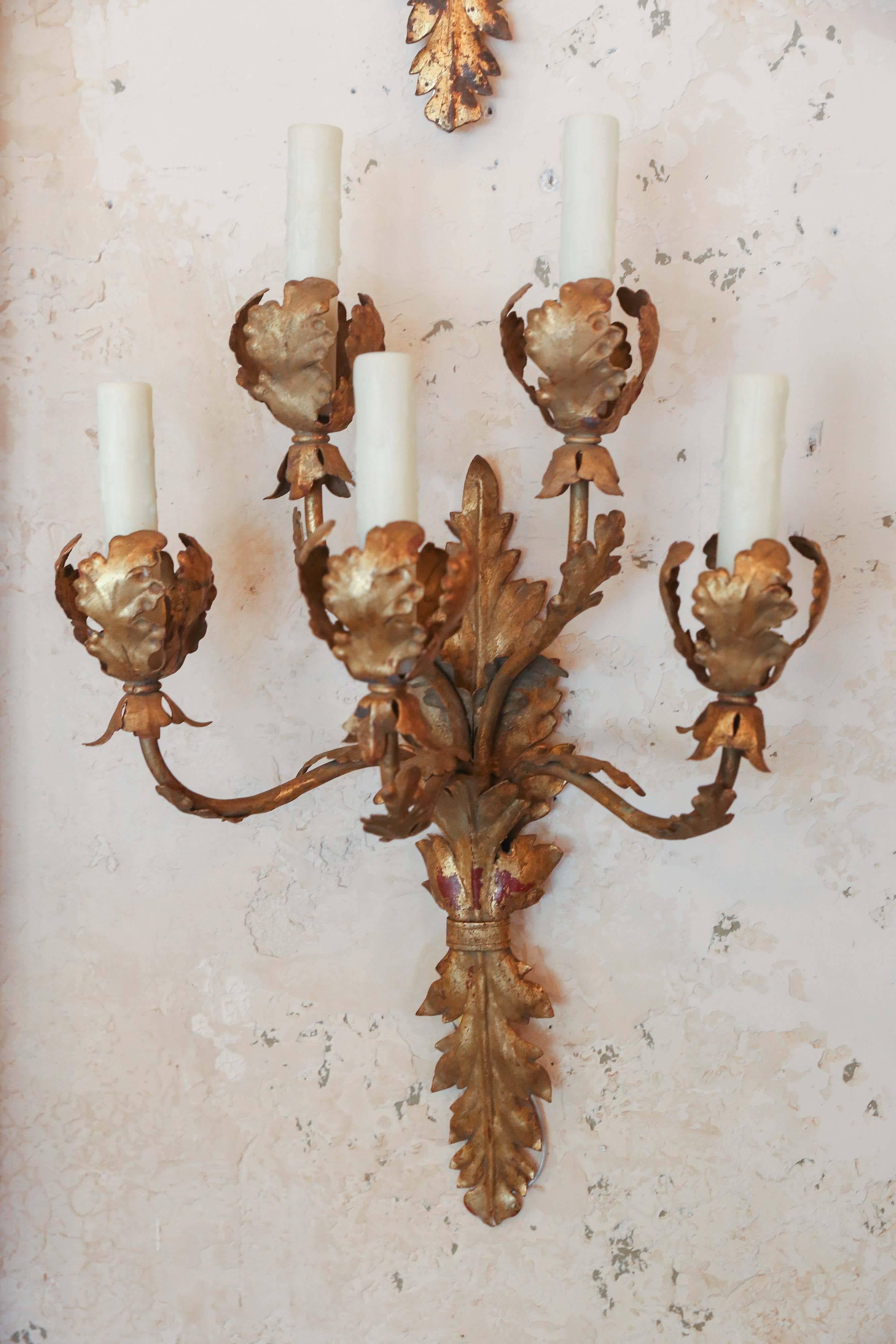 Pair Italian five-arm tole and gilt sconces with great patina. Have been wired for the US.