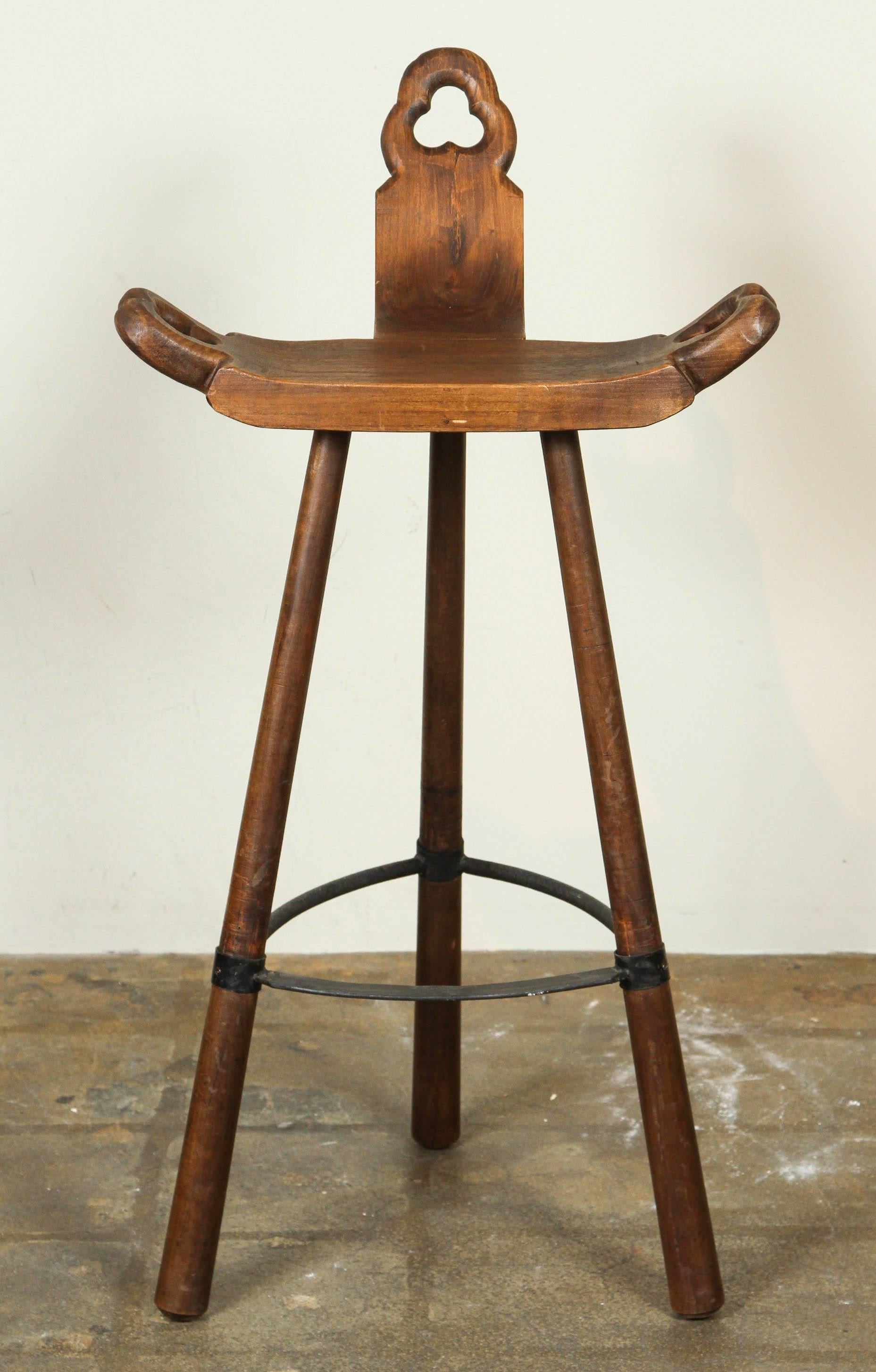 Carved wooden and iron stool (possibly African). We think this is early 20th century or older, but have listed them as Mid-Century to error on the safe side.
   
   