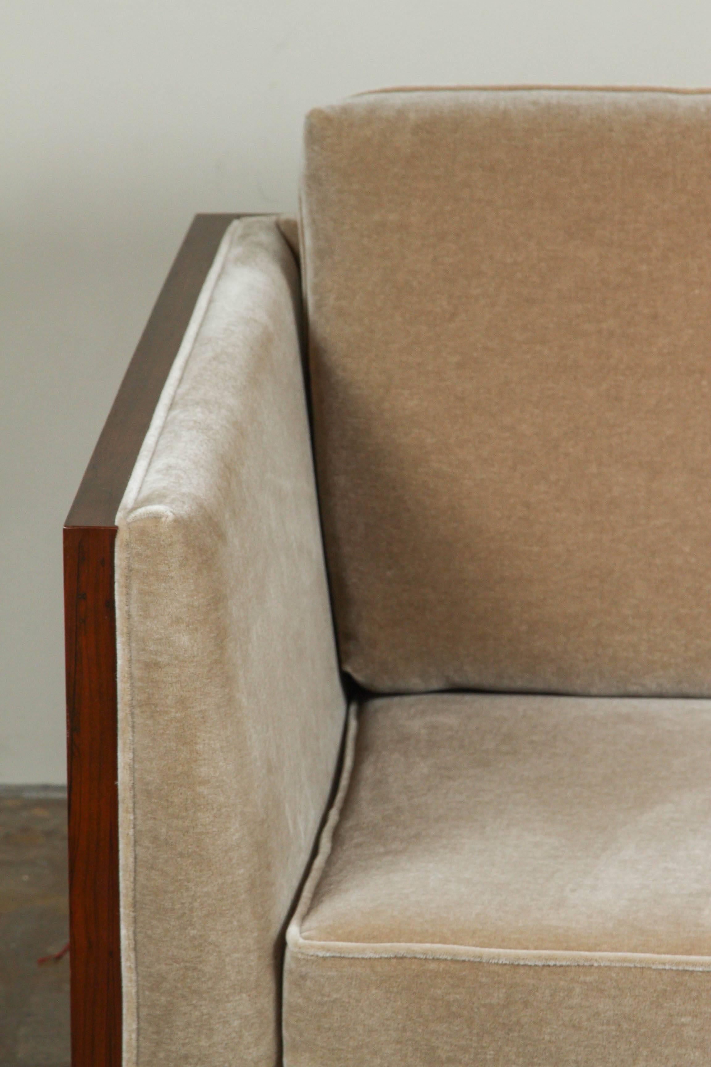 Milo Baughman rosewood case lounge chair. Newly upholstered in a grey mohair.