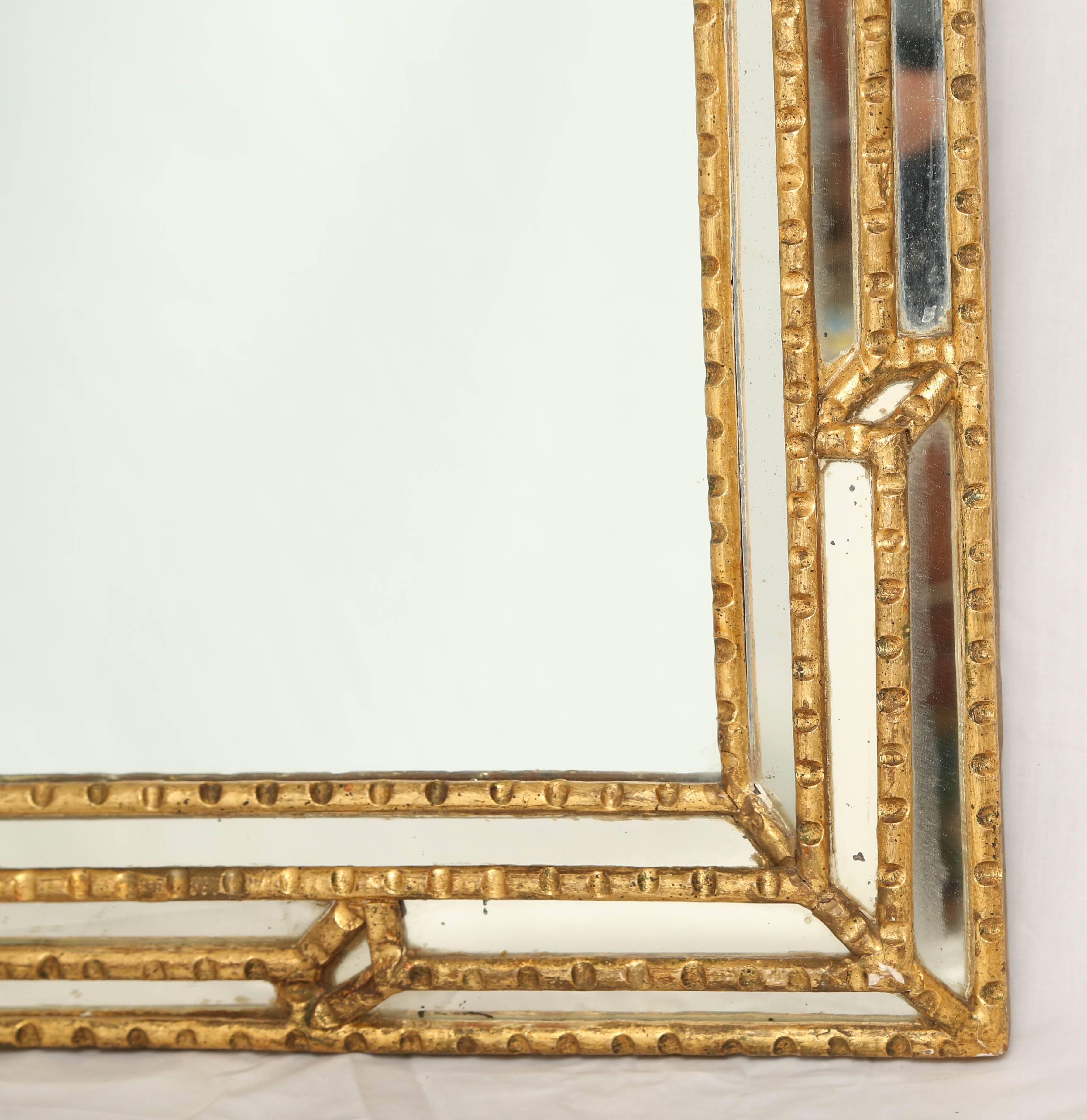 Italian Giltwood Mirror with Reliefs In Excellent Condition In West Palm Beach, FL