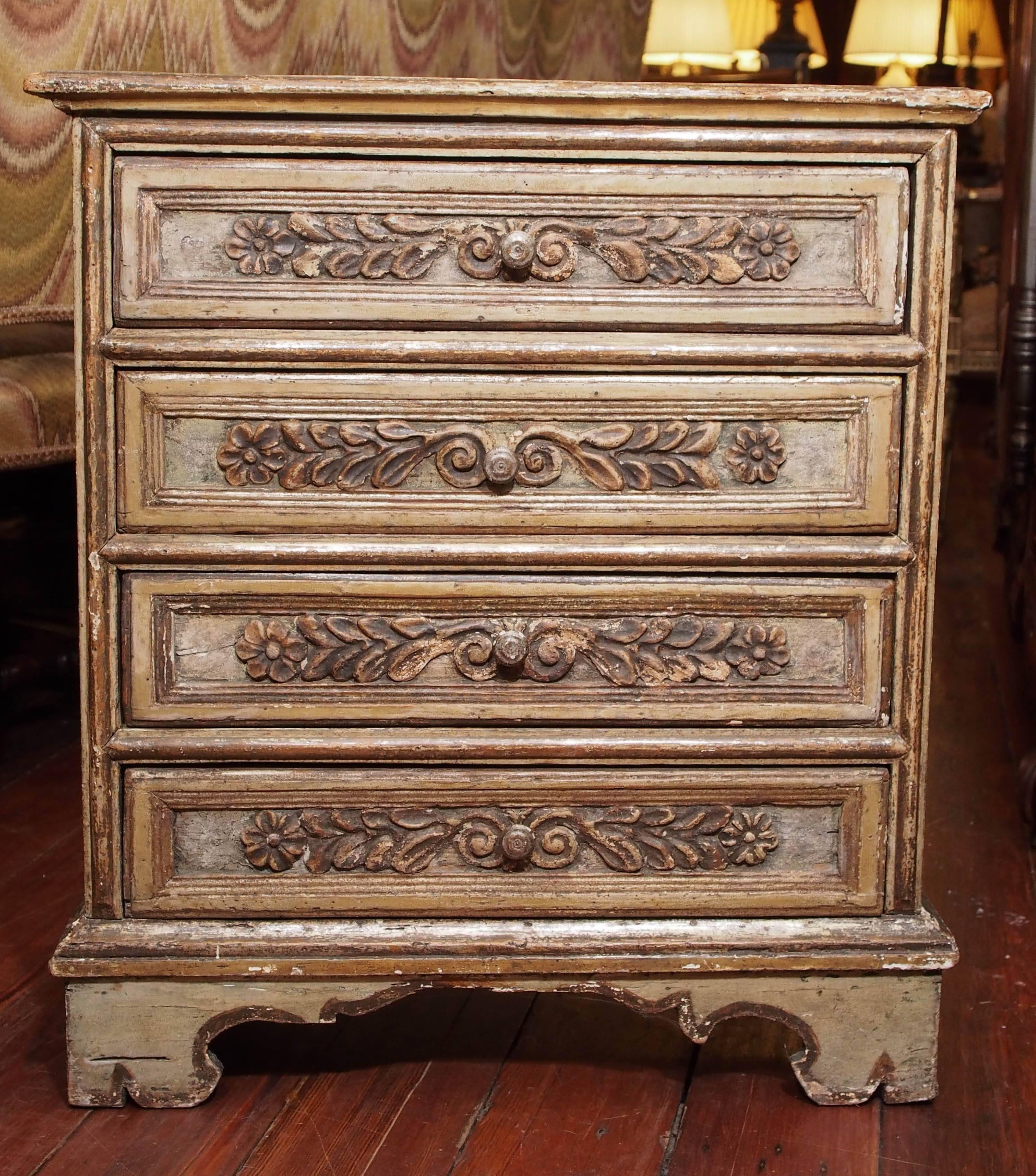 Unusually small gilt and painted Italian four-drawer commodini.