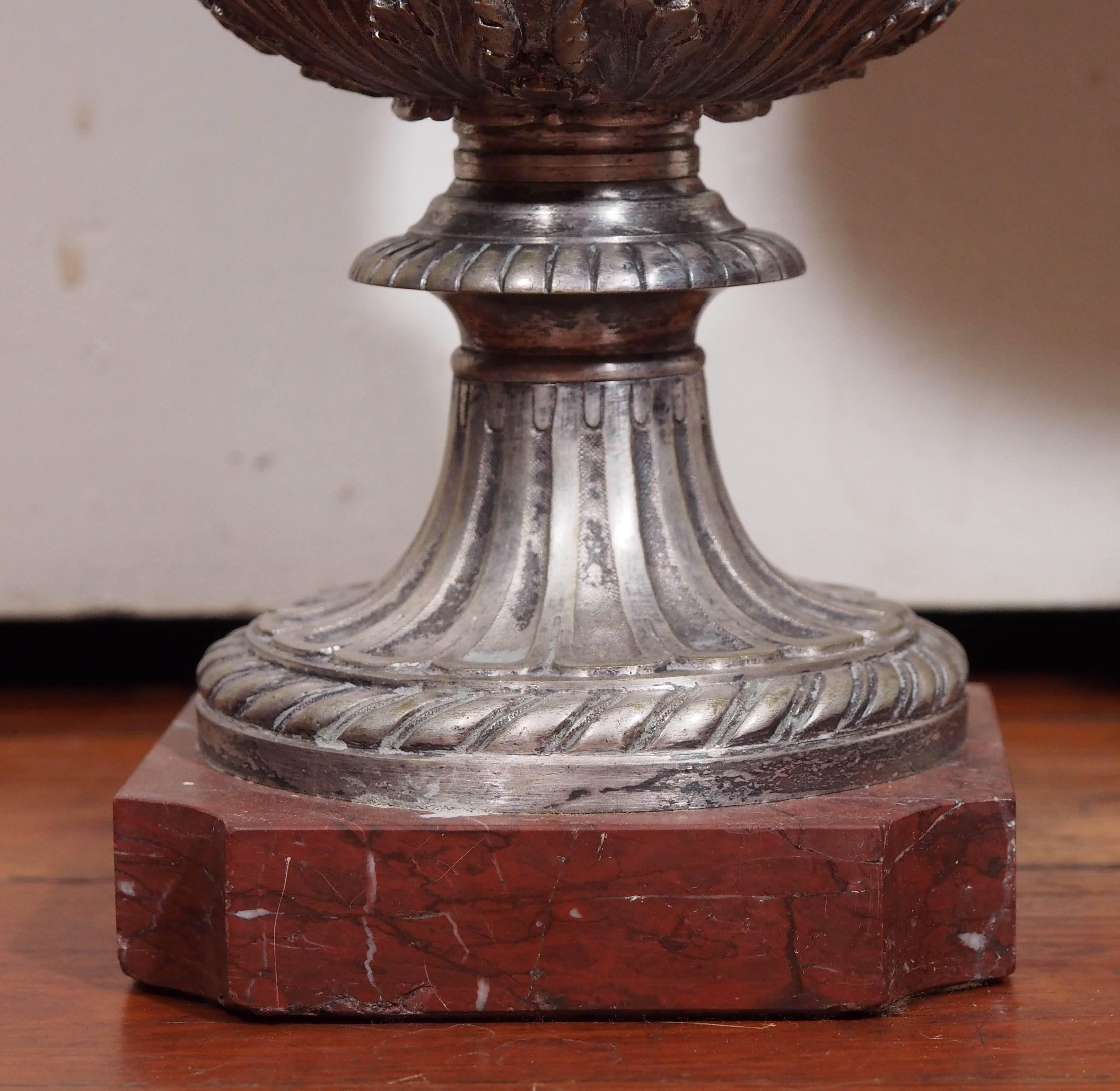 Pair of French Neoclassical Silver over Bronze Urns on Rouge Marble In Good Condition For Sale In Natchez, MS