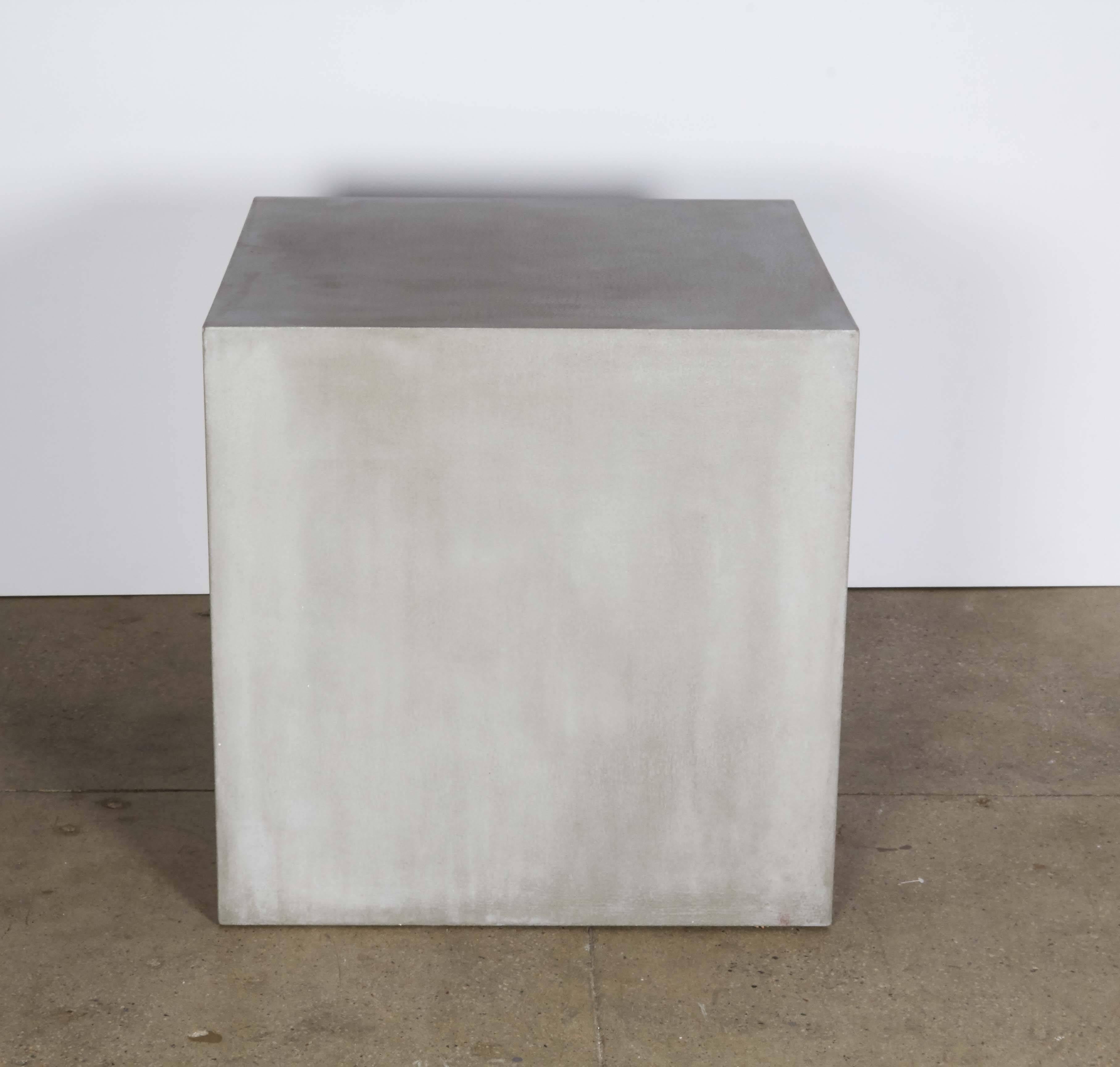 Concrete block forming a cocktail table.