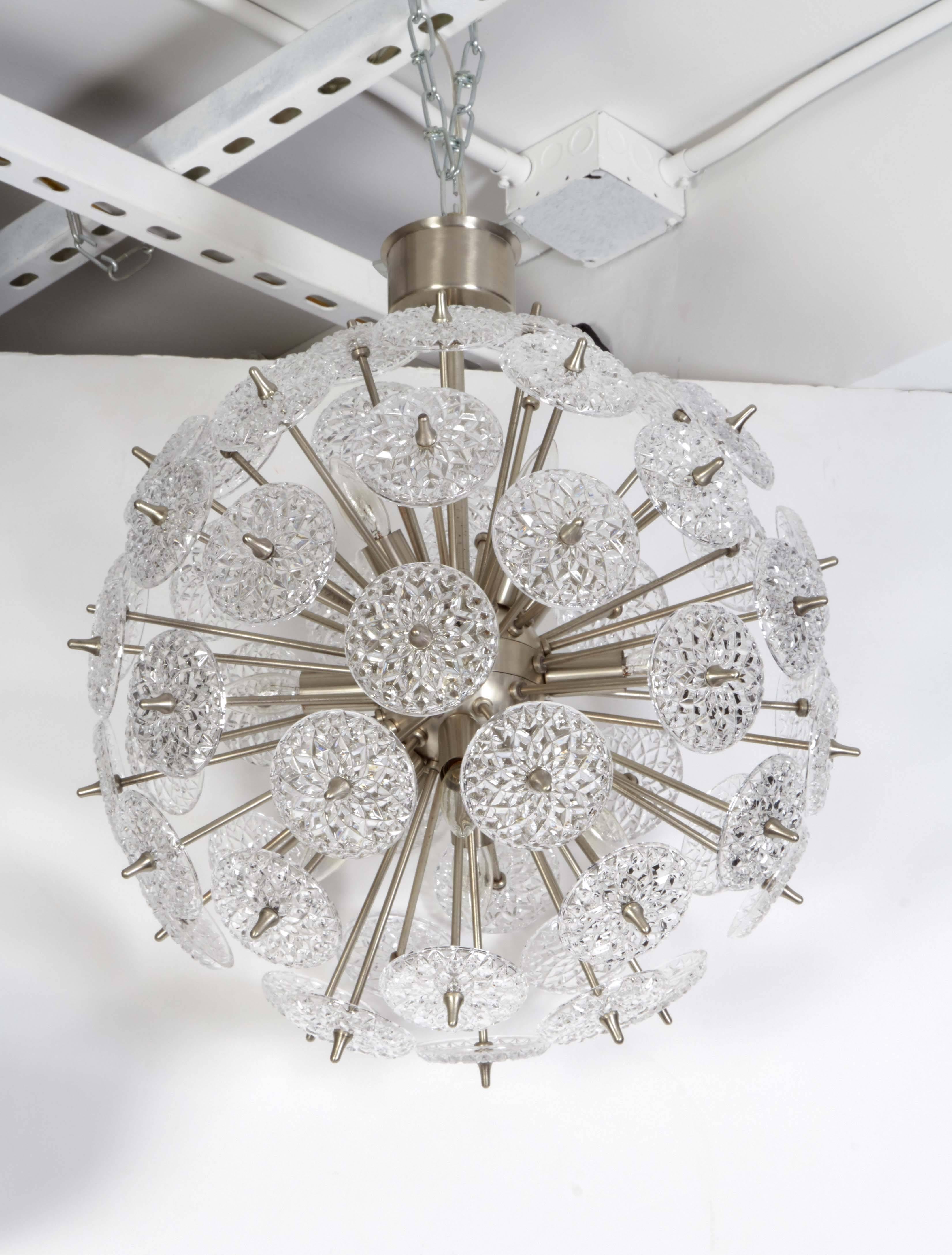 Striking Mid-Century Sputnik chandelier with cut-glass roundels on a satin nickel frame with canopy. Rewired for use in the USA, uses twelve chandelier type bulbs. Gives off an amazing glow when illuminated.

