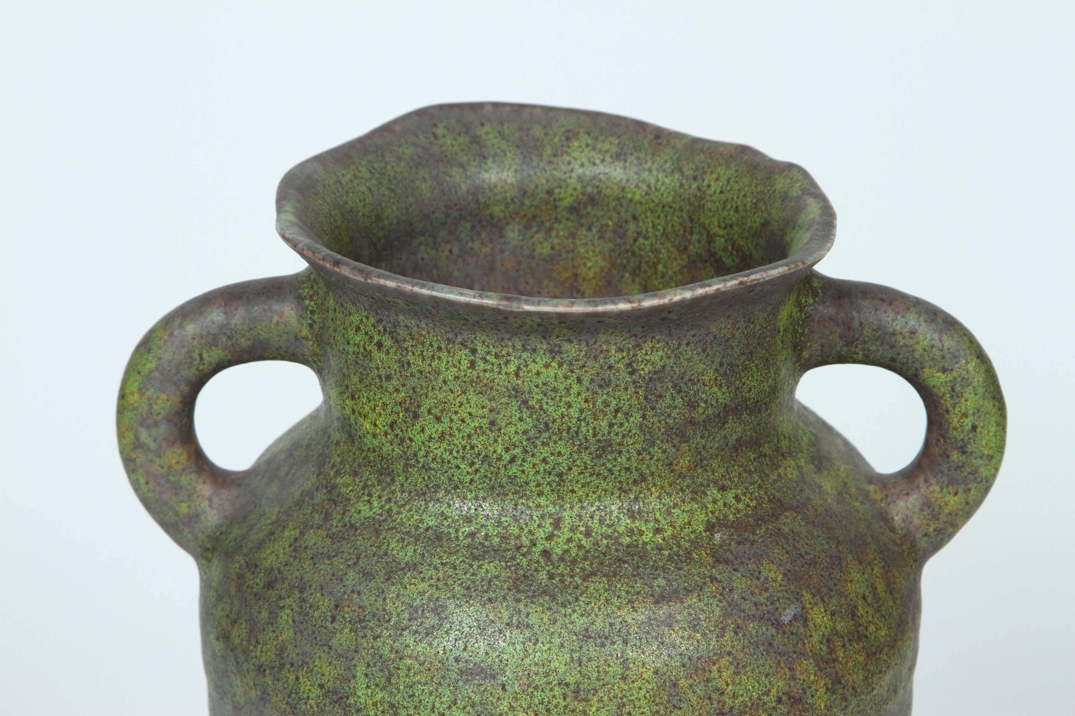 Vintage Royal Haeger urn vase with two handles in a green matte finish and brown fleck. Marked 