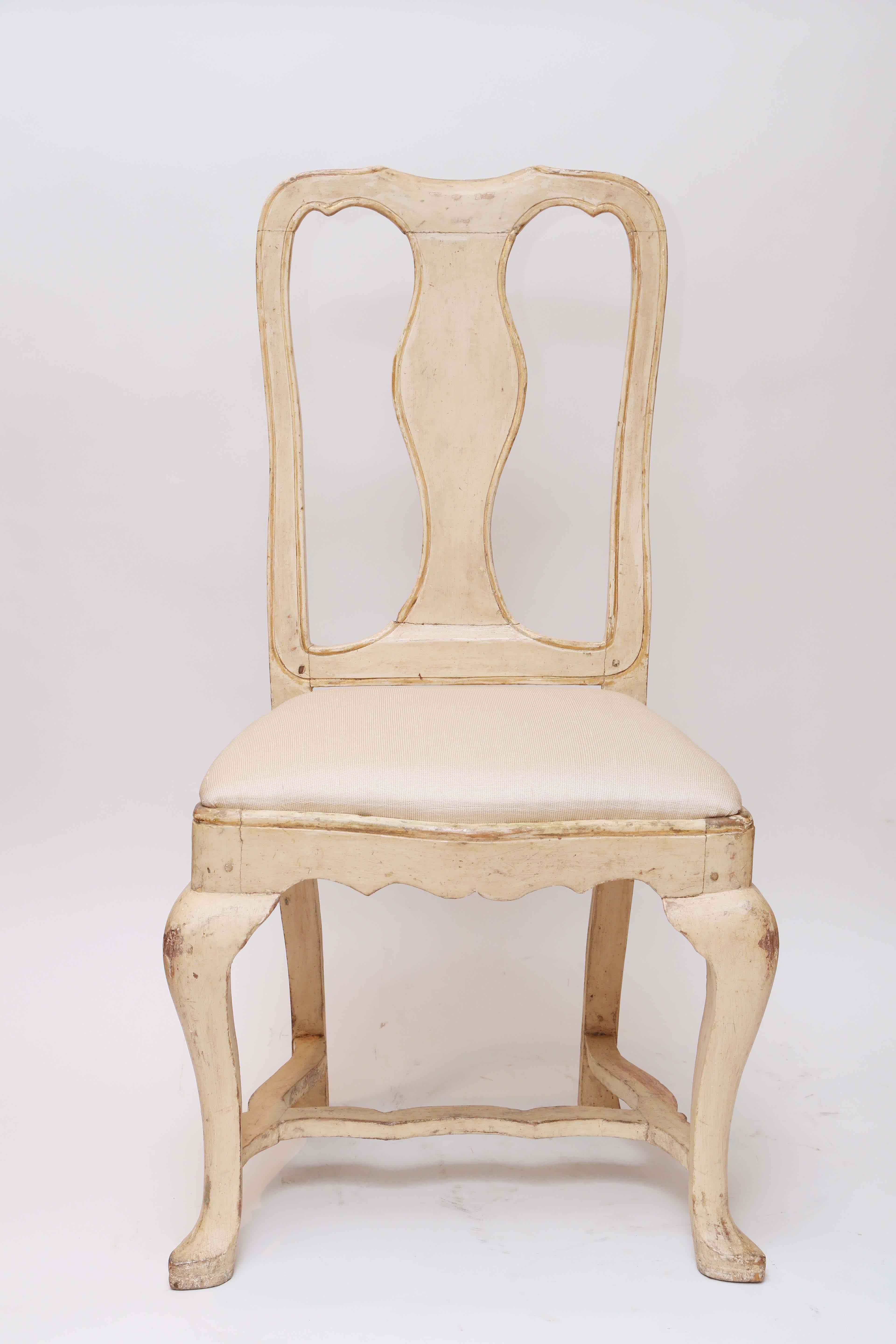 Striking set of six 18th century Gustavian dining chairs with original paint and silk fabric seat cushions.