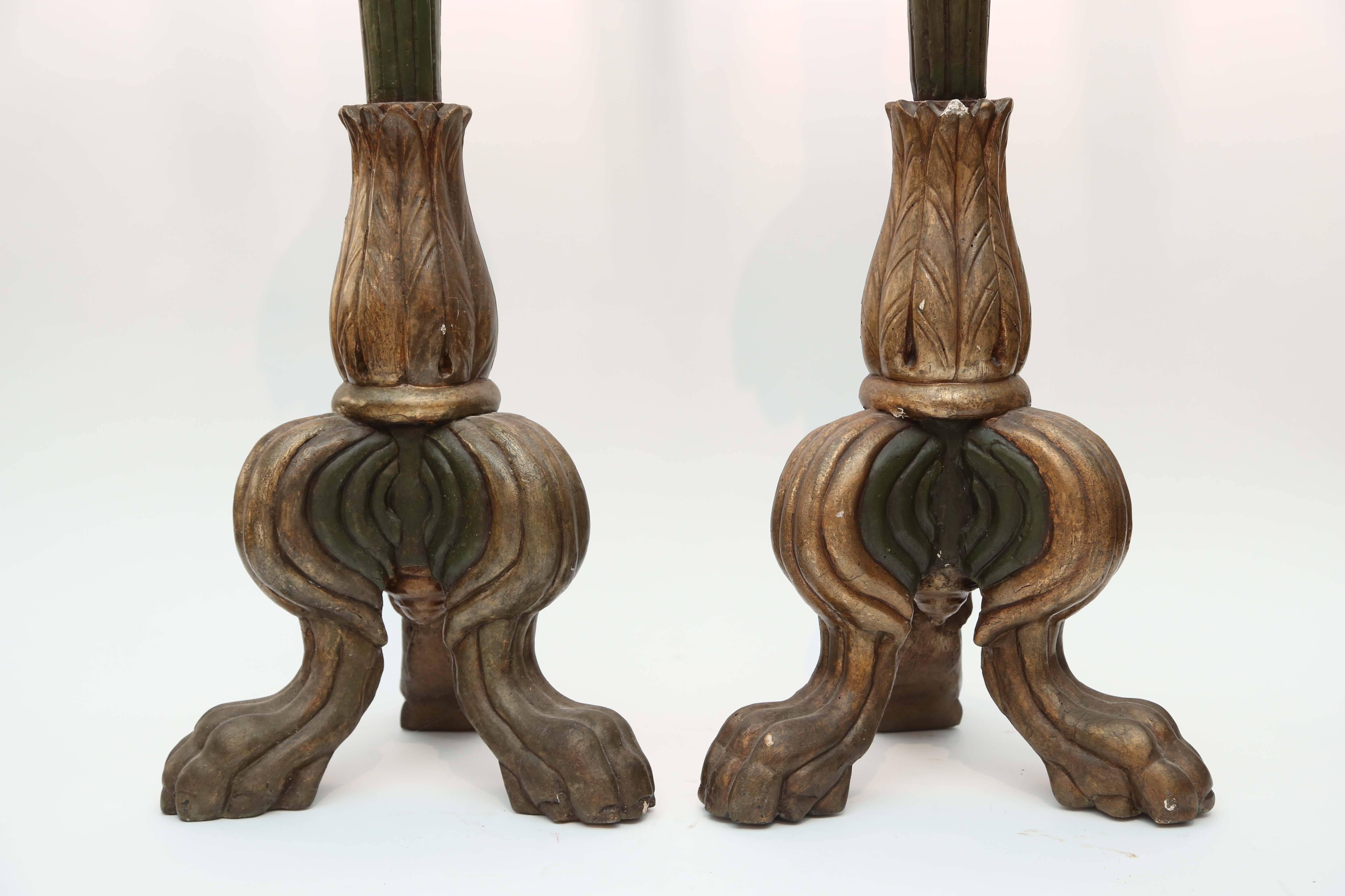 Pair of 19th century Italian candle stands. Elegant style and proportions with "paw" feet and crisp carving.