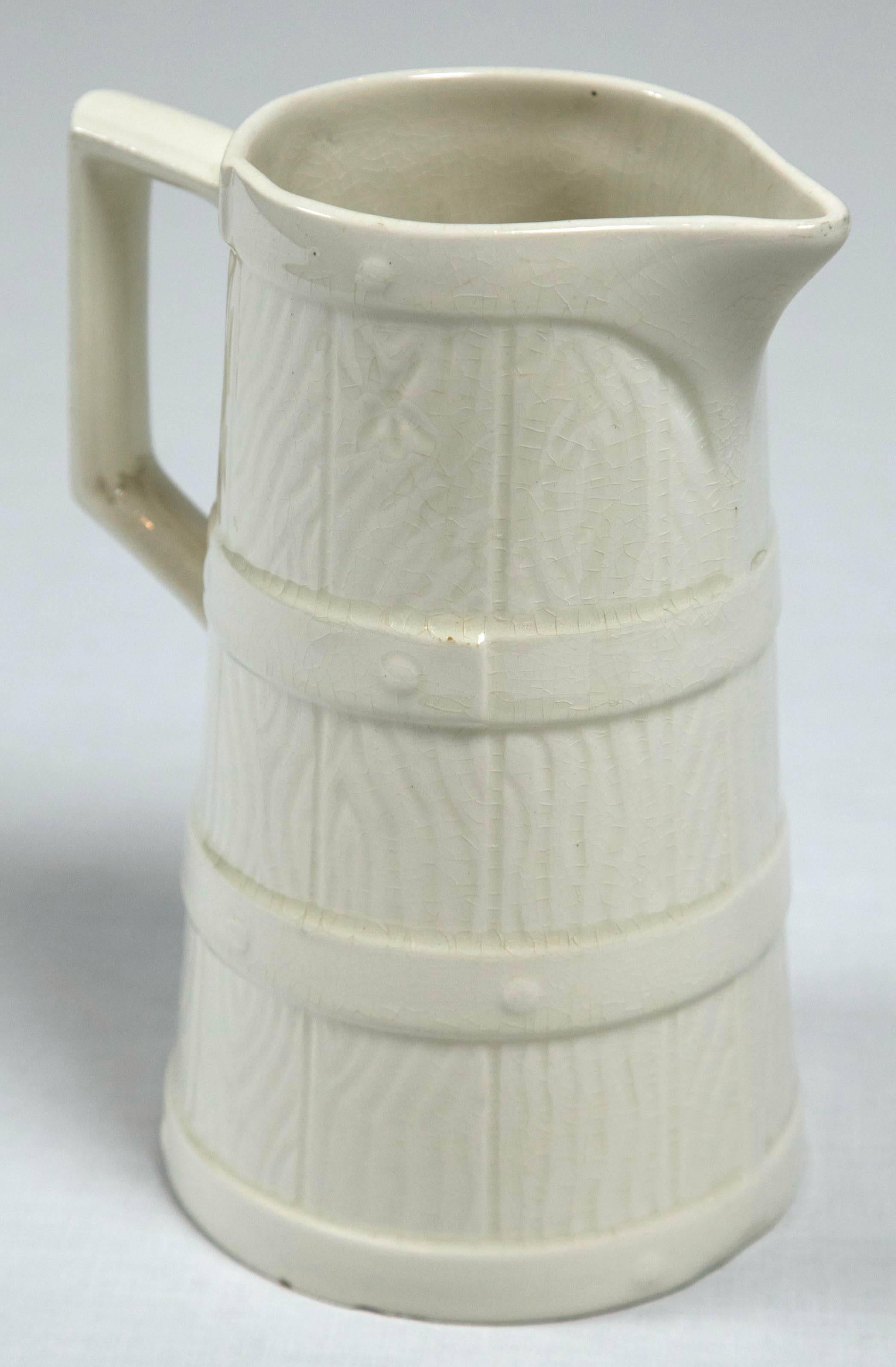 Luneville pottery pitcher, circa 1900, France. Designed as a faux bois (wood) jug with banded detail. Luneville is a French faience factory originally established in 1730.