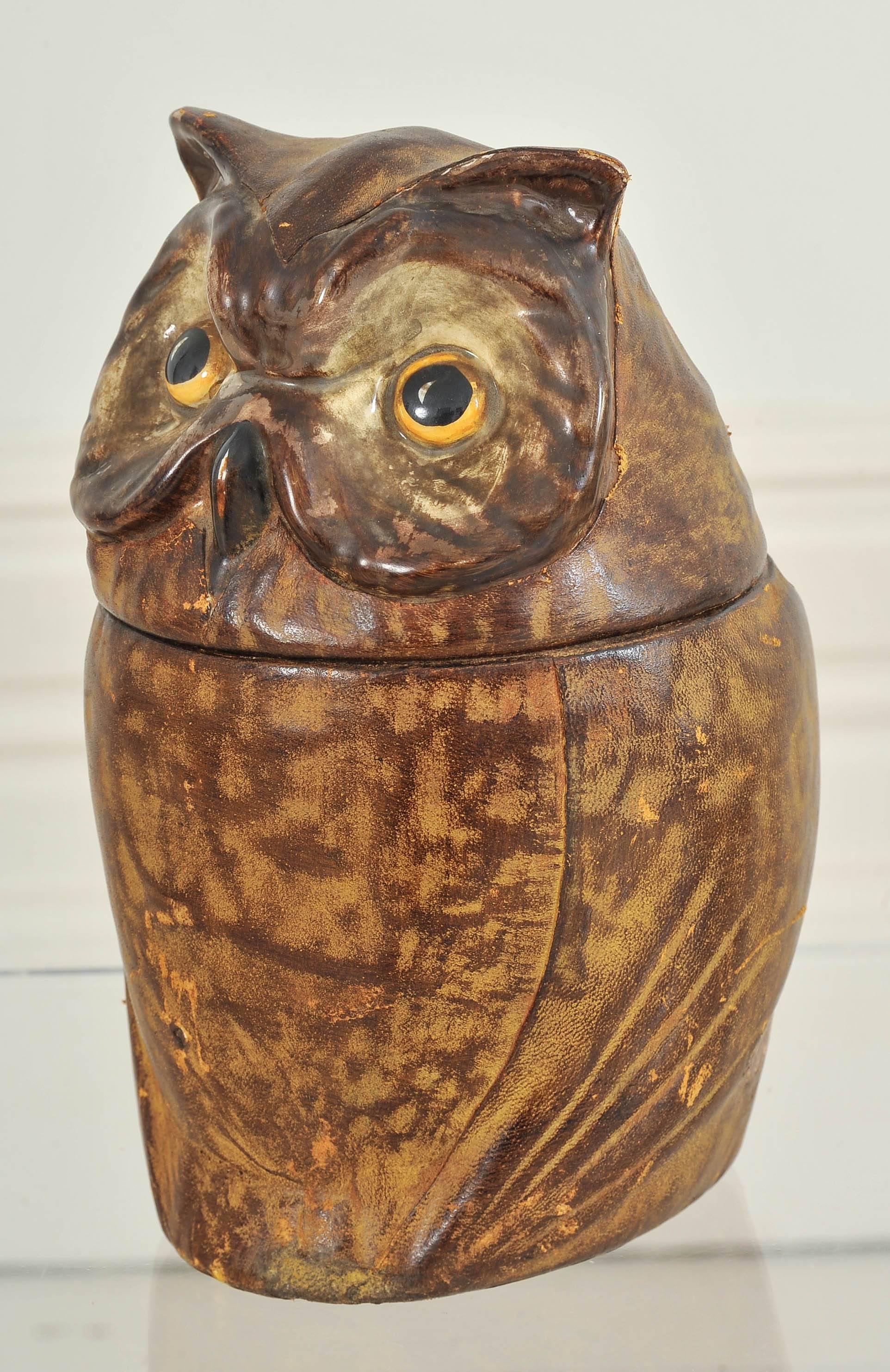 A very unusual French ceramic and leather owl cookie jar.

Shipping: We are happy to ship this item to you for an additional cost. Please contact us for a quote.