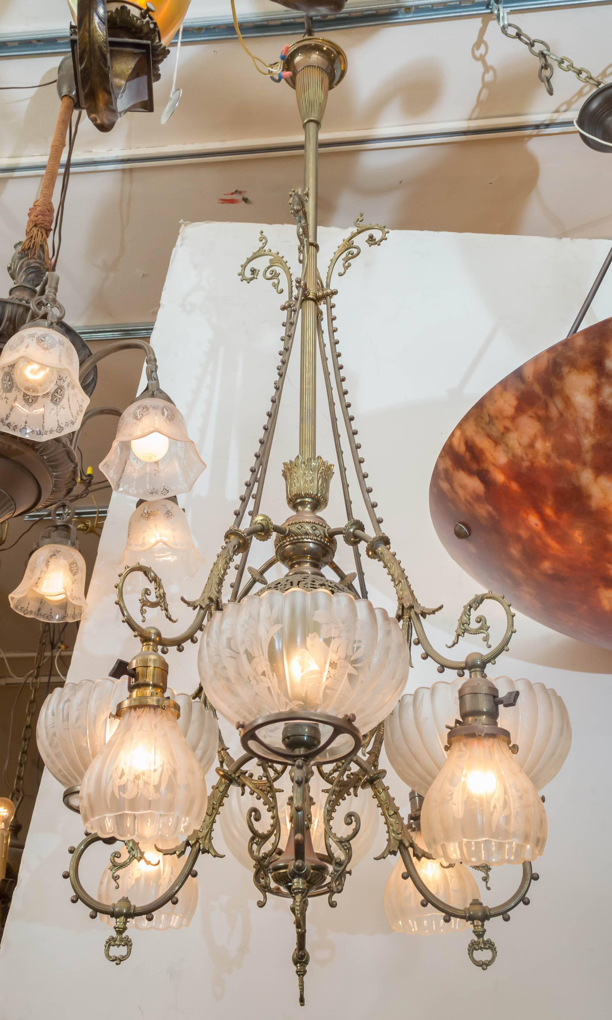 This is certainly one of the finest combination gas and electric chandeliers we have offered in a very long time. People love that pierced ball center. Please check this one out for size and quality. The deep etched period, original shades just