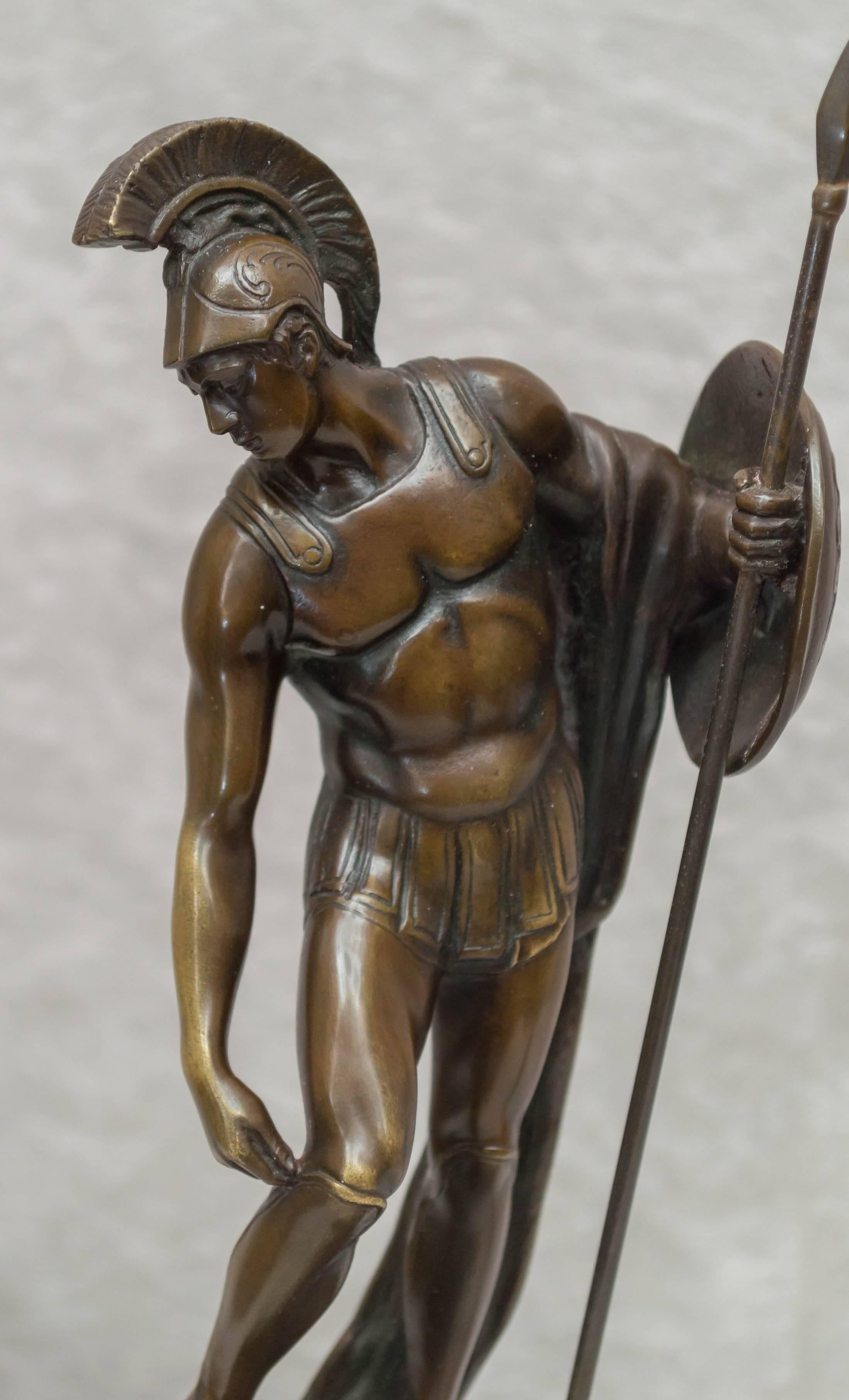 We are always on the lookout for good bronze figures of warriors. We feel we have a very good one right here. This handsome male figure is preparing for battle. Well defined with rich dark brown patina, and mounted on a quality marble base. It is