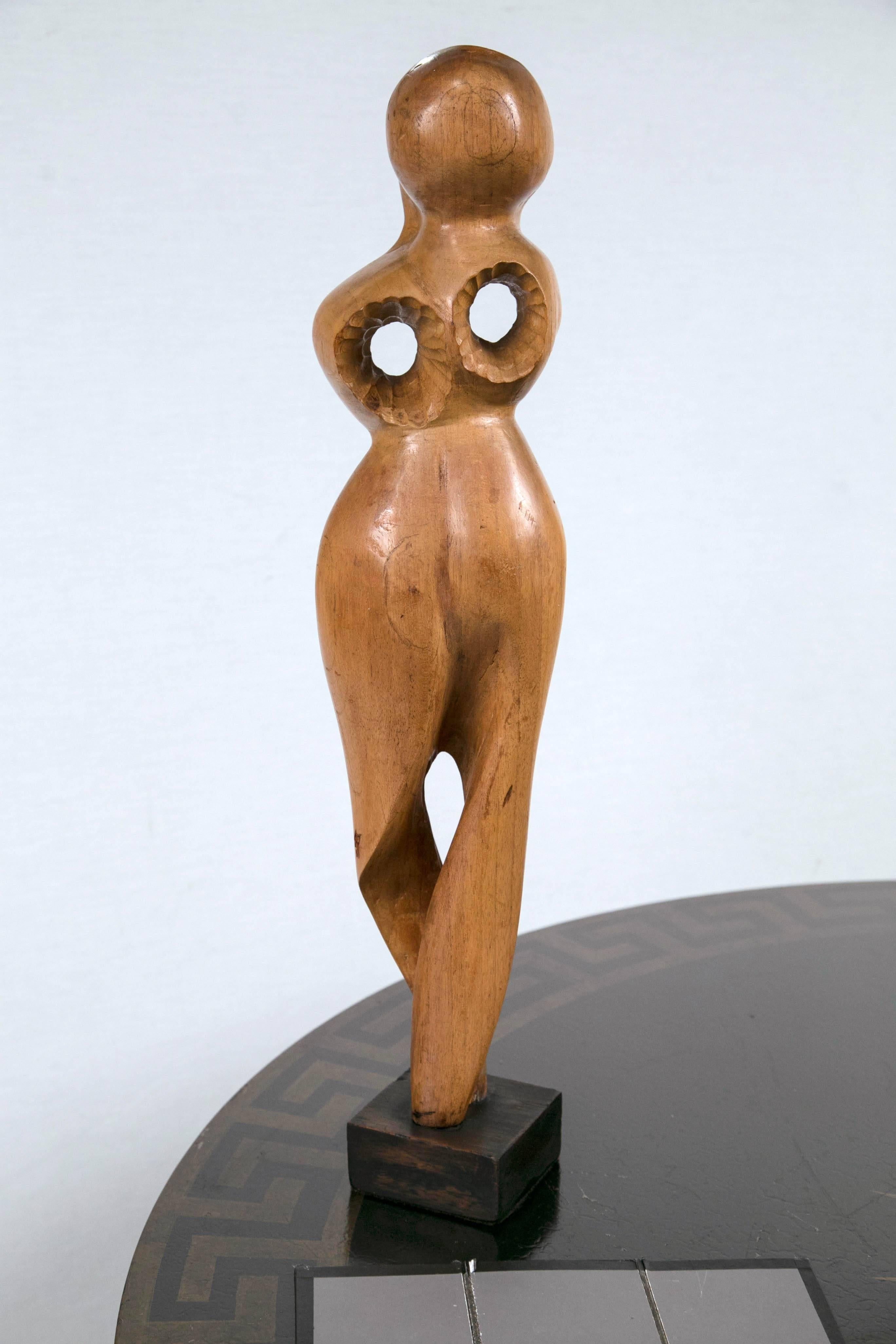 Hand-carved wood figural sculpture. Very modern and dramatic, but maintains a softness that will complement any style.