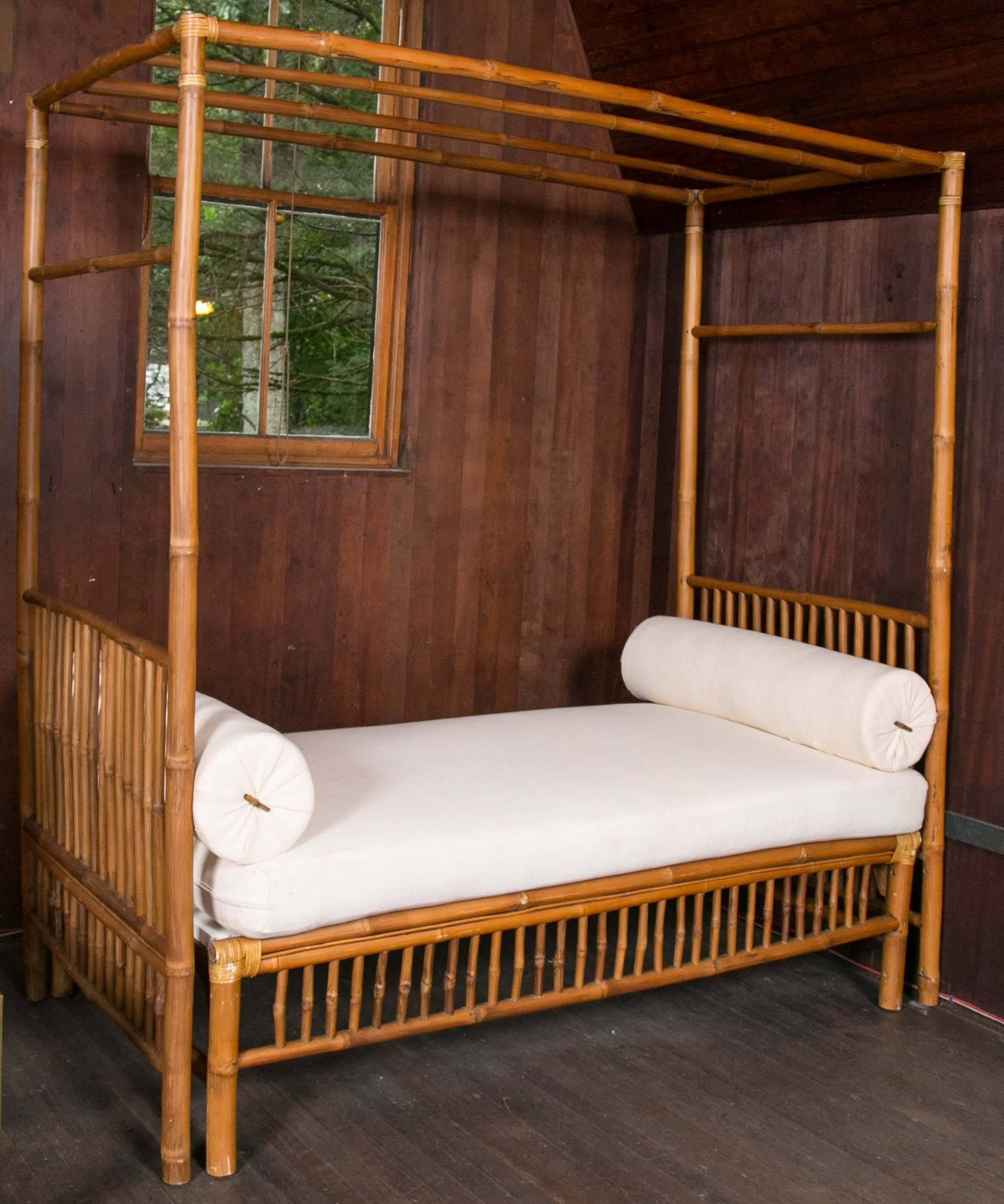 Dramatic bamboo canopy daybed. Bed cushion height is 25".