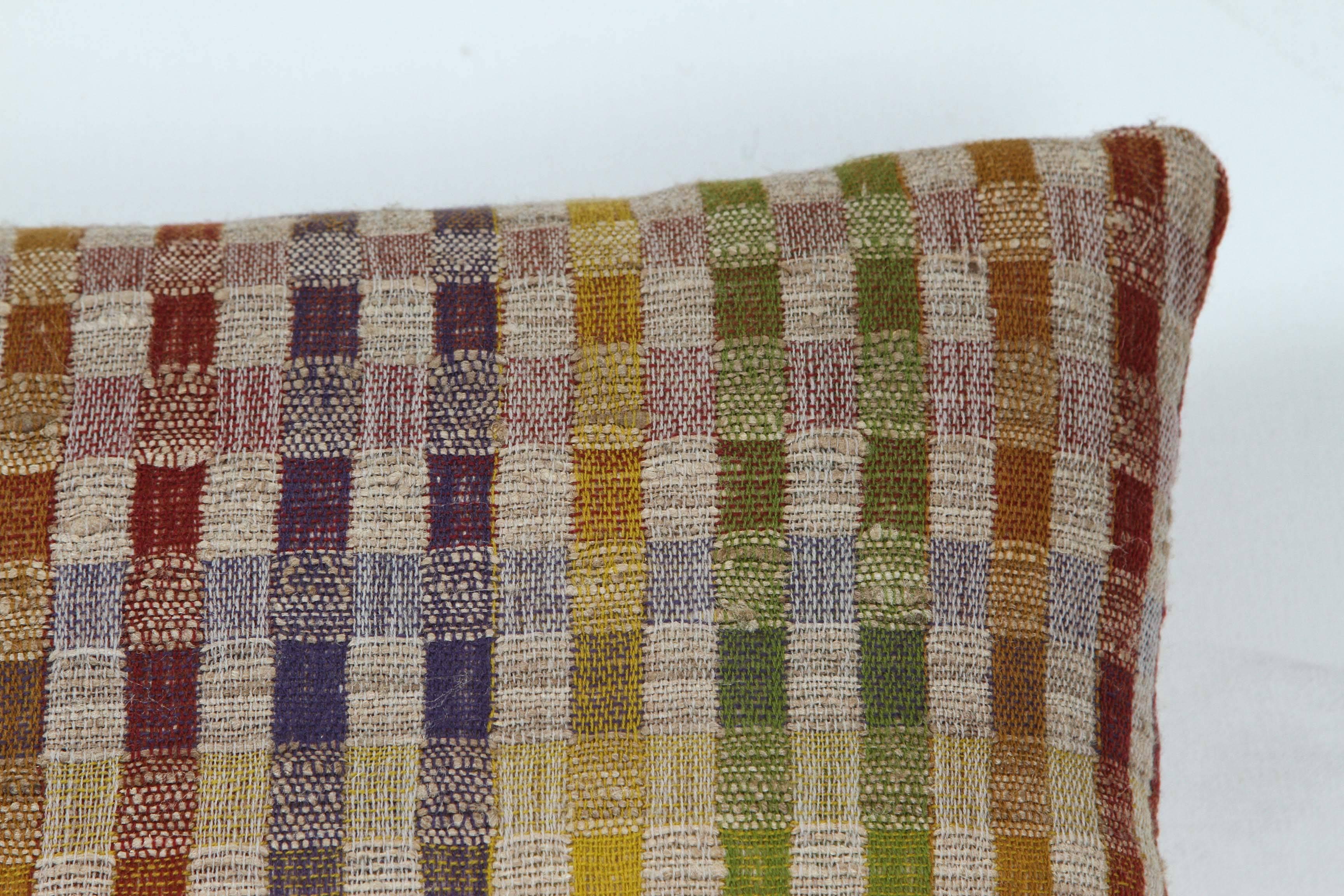 A contemporary line of cushions, pillows, throws, bedcovers, bedspreads and yardage handwoven in India on antique jacquard looms. Handspun wool, cotton, linen, and raw silk give the textiles an appealing uneven quality.

This wool and raw tussar