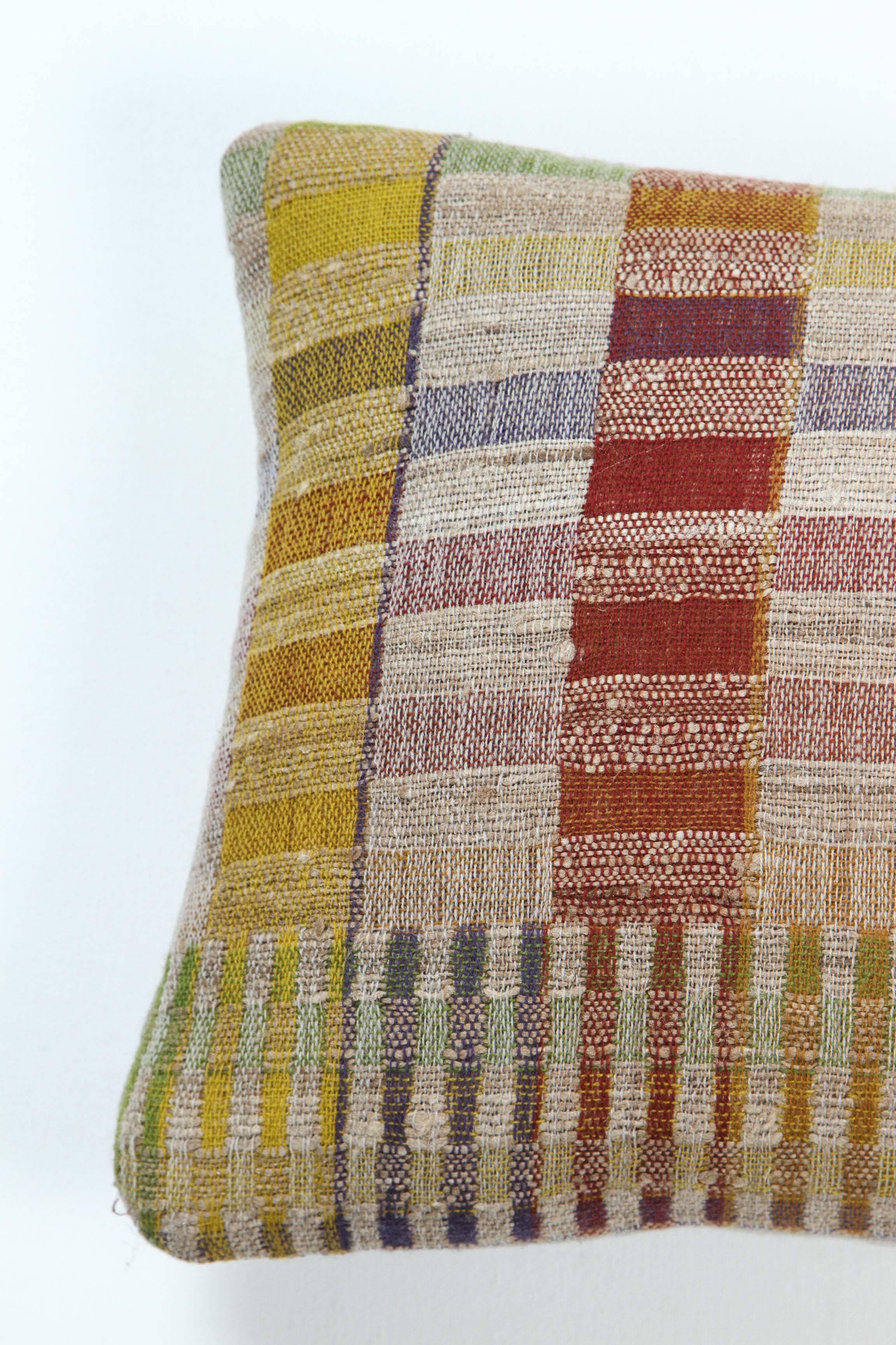 A contemporary line of cushions, pillows, throws, bedcovers, bedspreads and yardage handwoven in India on antique jacquard looms. Handspun wool, cotton, linen and raw silk give the textiles an appealing uneven quality.

This wool and raw tussar