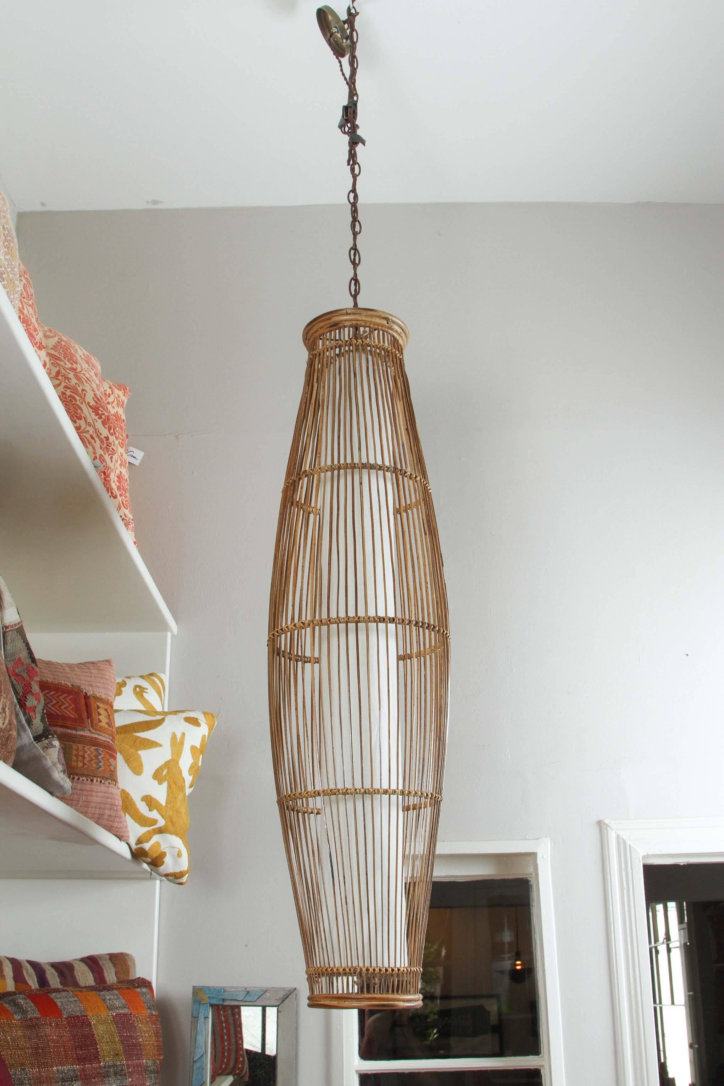 Vintage bamboo light with three sockets inside a white cotton fabric tube. Updated electrical fittings and hardware.