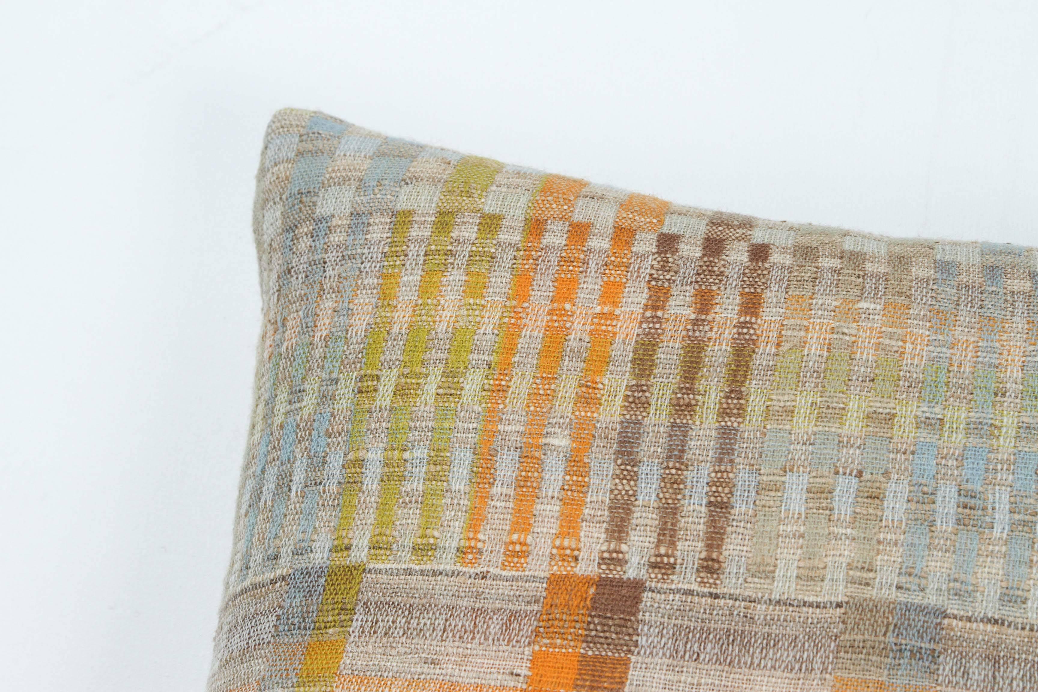 A contemporary line of cushions, pillows, throws, bedcovers, bedspreads and yardage handwoven in India on antique jacquard looms. Handspun wool, cotton, linen and raw silk give the textiles an appealing uneven quality.

This wool and raw tussar silk
