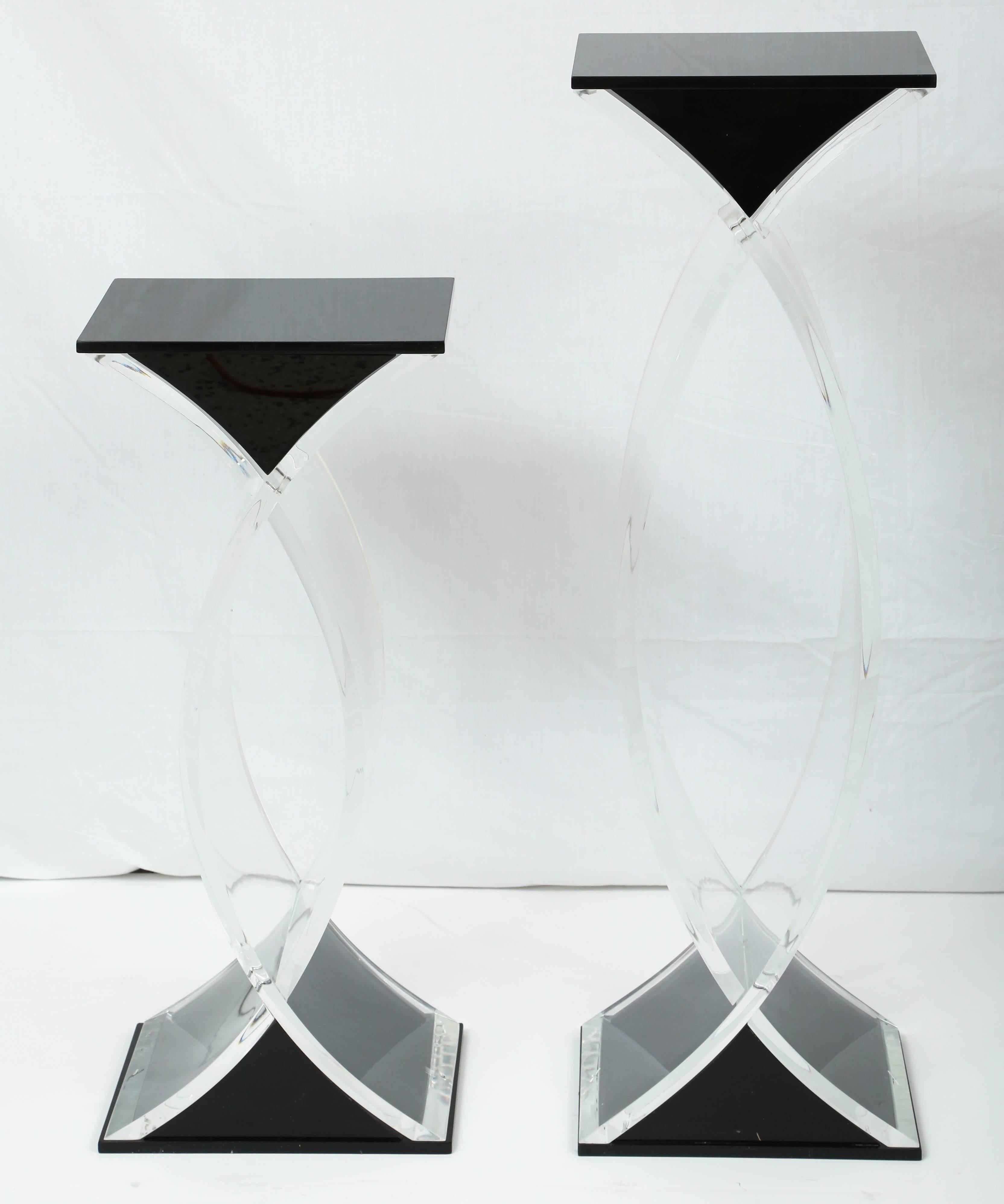 This set of pedestals are quite sculptural with their intersecting-form and use of clear and black Lucite. They date from the 1980s and most likely were bespoke pieces.

Note: Dimensions taller pedestal: 40