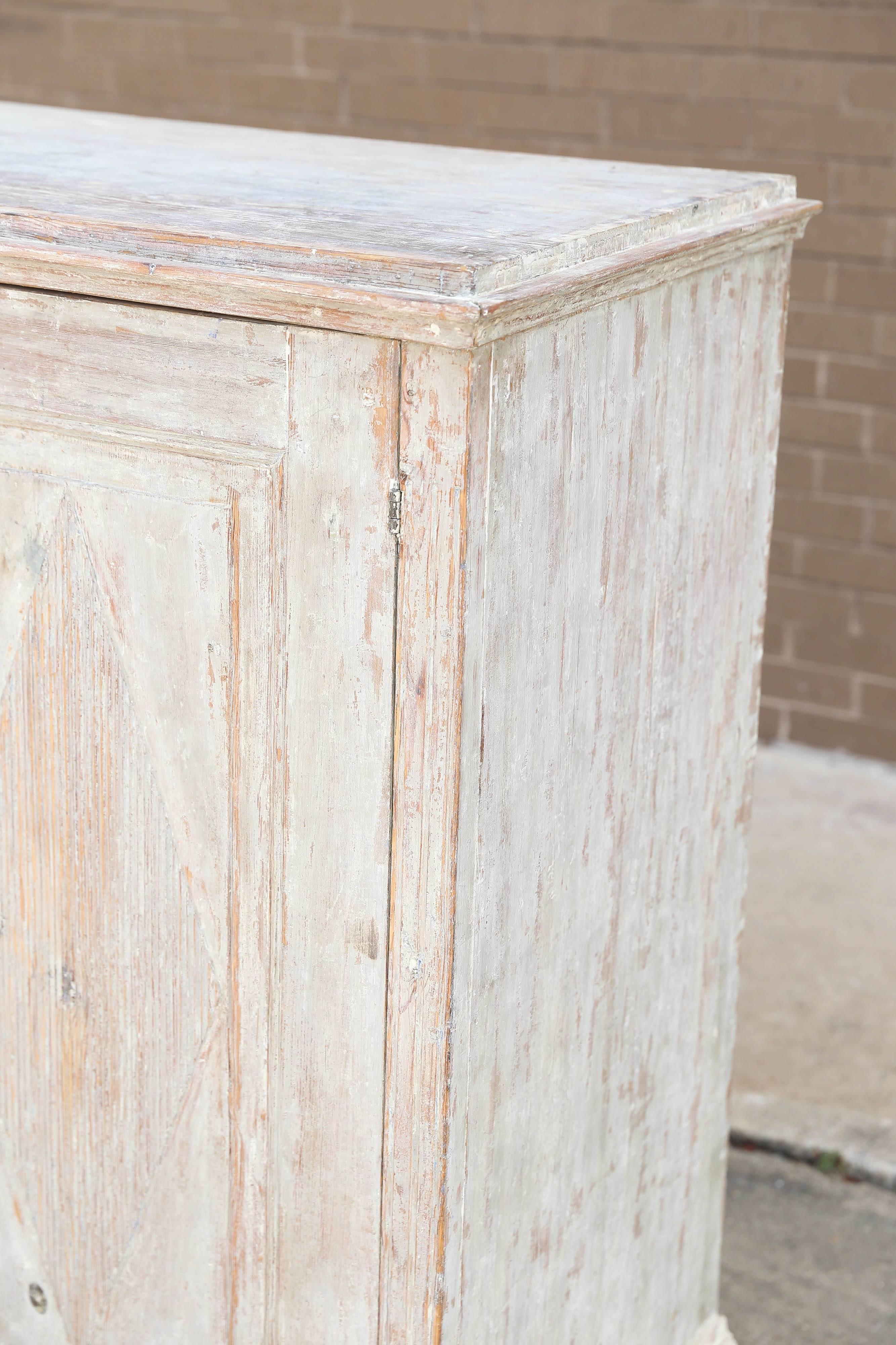 Swedish two-door buffet with typical Gustavian motif with three interior shelves.