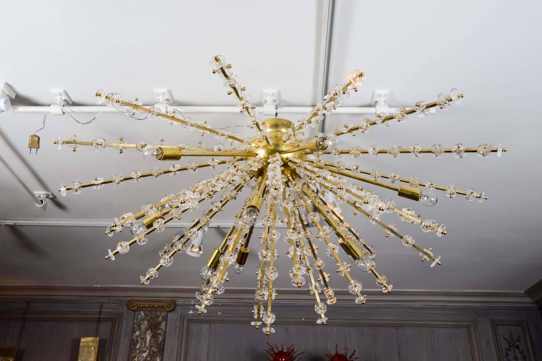 Brass and Murano glass half-Sputnik chandelier, nine bulbs.
A pair is available.