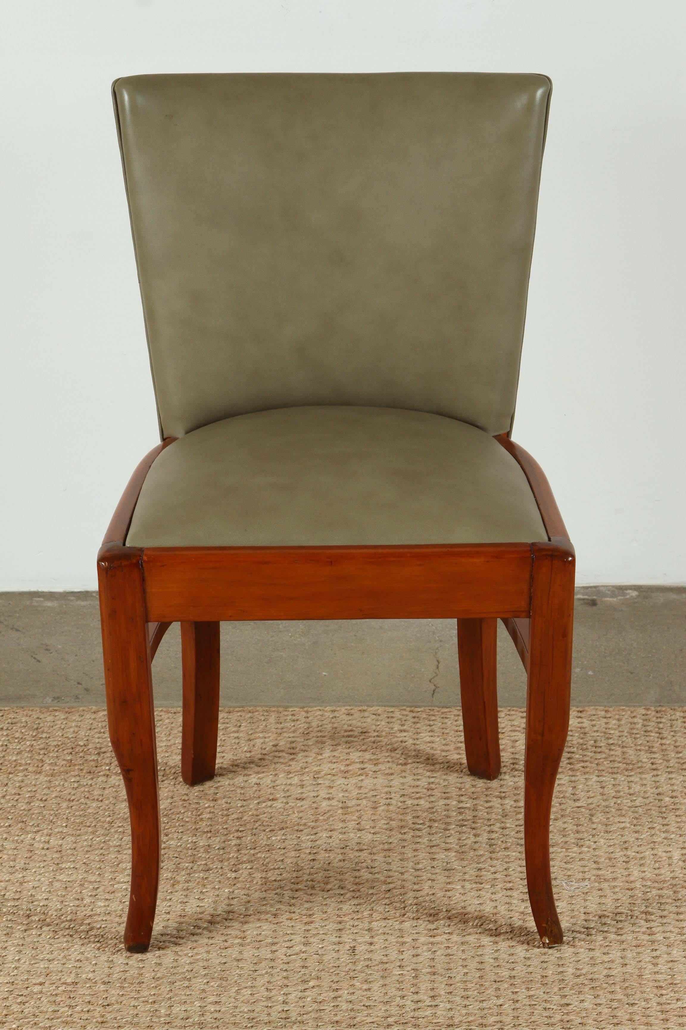 Set of six Mid-Century Art Deco chairs upholstered in olive toned leather.