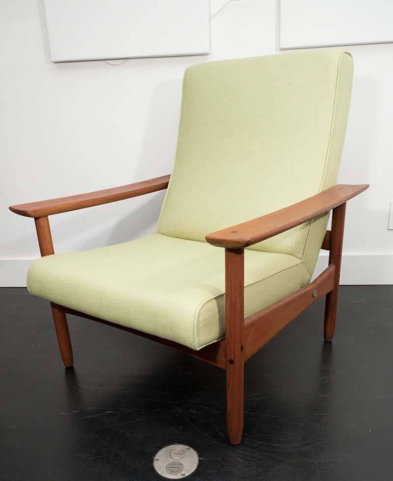 Pair of Steiner armchairs, with teak frames with large armrest and dowel details. Upholstered in cotton.